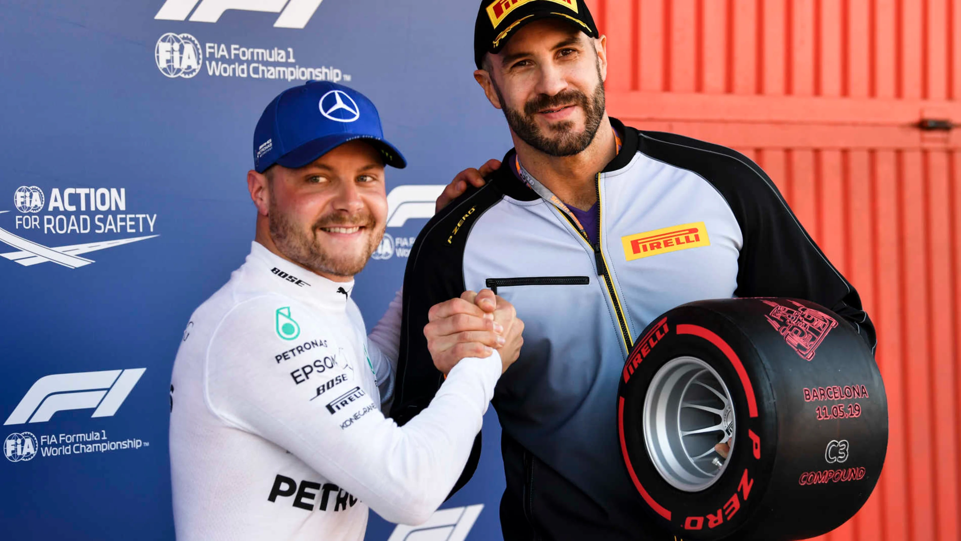 CIRCUIT DE BARCELONA-CATALUNYA, SPAIN - MAY 11: WWE wrestler Cesaro presents Valtteri Bottas,