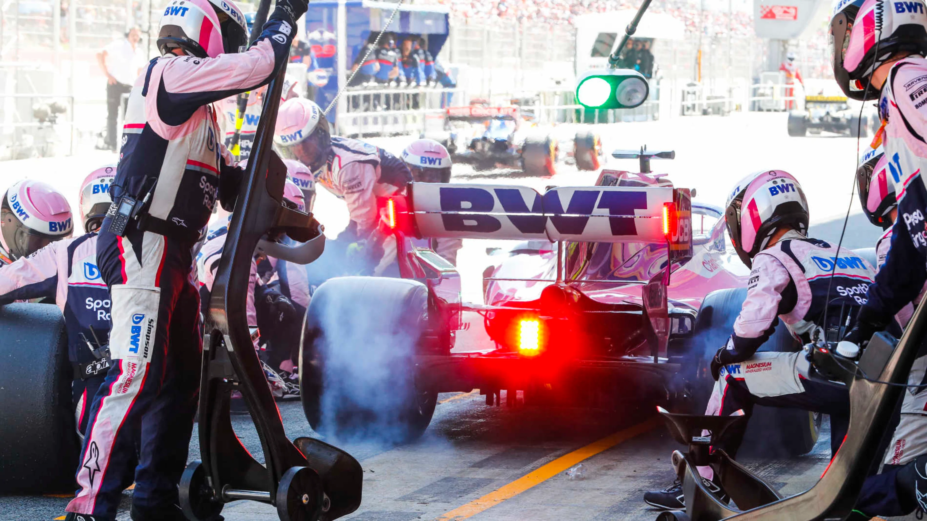 CIRCUIT DE BARCELONA-CATALUNYA, SPAIN - MAY 12: Sergio Perez, Racing Point RP19 pit stop with wheel