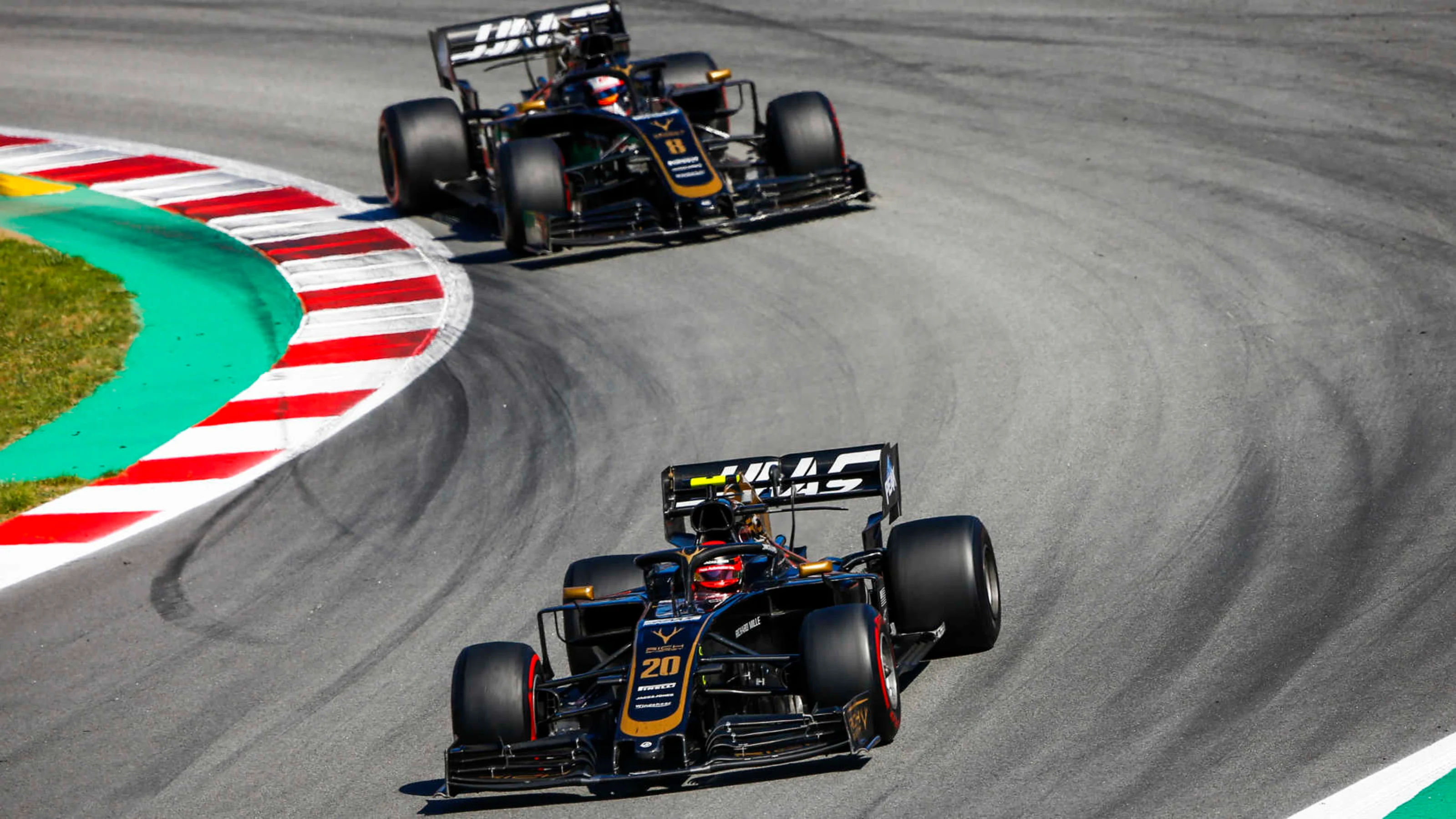 CIRCUIT DE BARCELONA-CATALUNYA, SPAIN - MAY 12: Kevin Magnussen, Haas VF-19 leads Romain Grosjean,