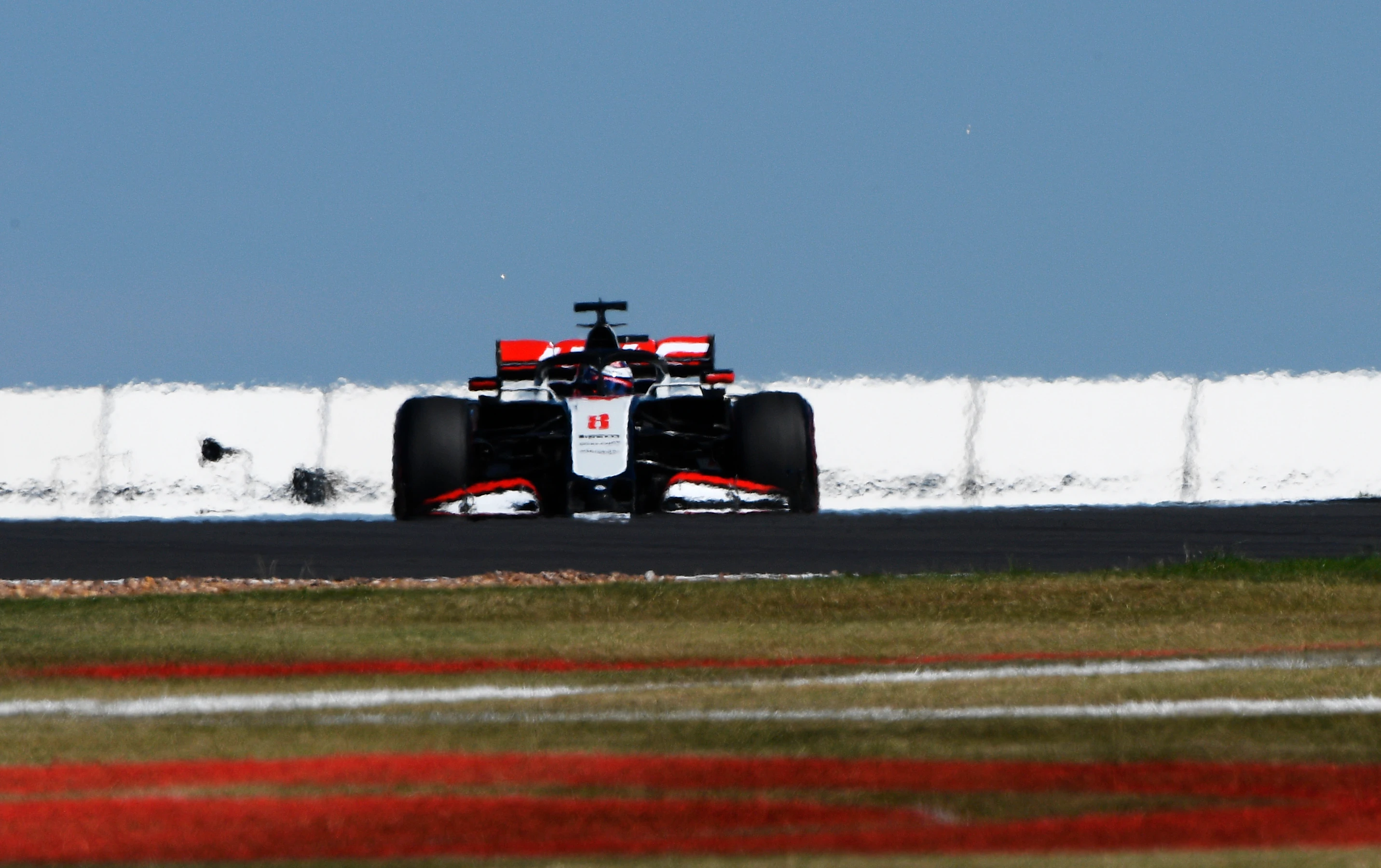 NORTHAMPTON, ENGLAND - AUGUST 07: Romain Grosjean of France driving the (8) Haas F1 Team VF-20
