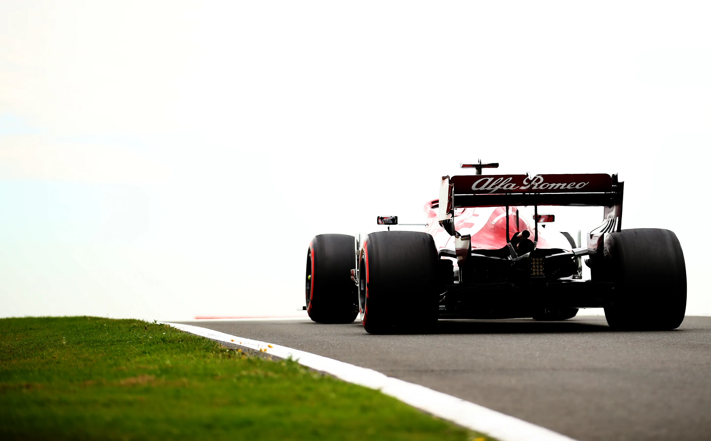 NORTHAMPTON, ENGLAND - AUGUST 07: Kimi Raikkonen of Finland driving the (7) Alfa Romeo Racing C39
