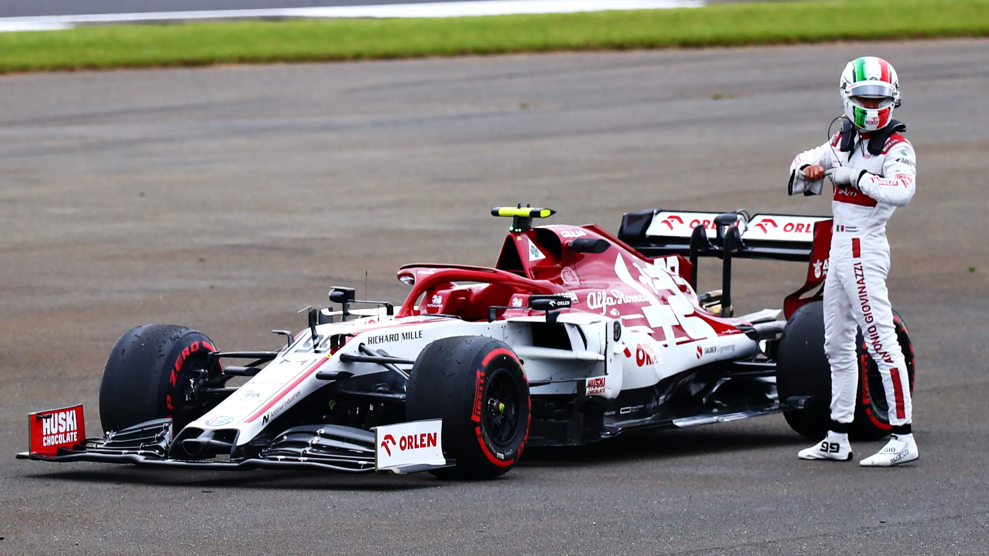 NORTHAMPTON, ENGLAND - AUGUST 07: Antonio Giovinazzi of Italy and Alfa Romeo Racing walks from his