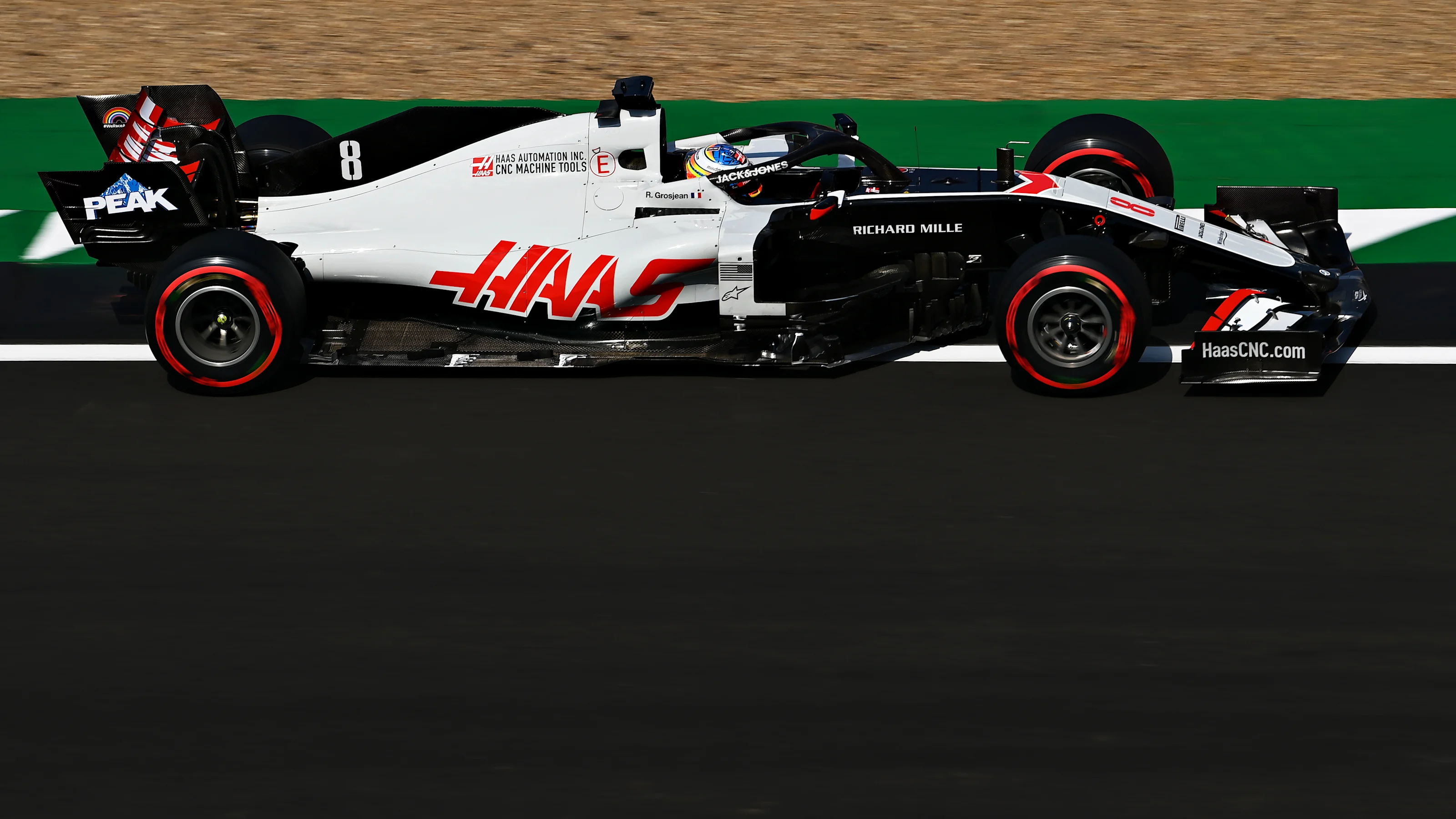NORTHAMPTON, ENGLAND - AUGUST 08: Romain Grosjean of France driving the (8) Haas F1 Team VF-20