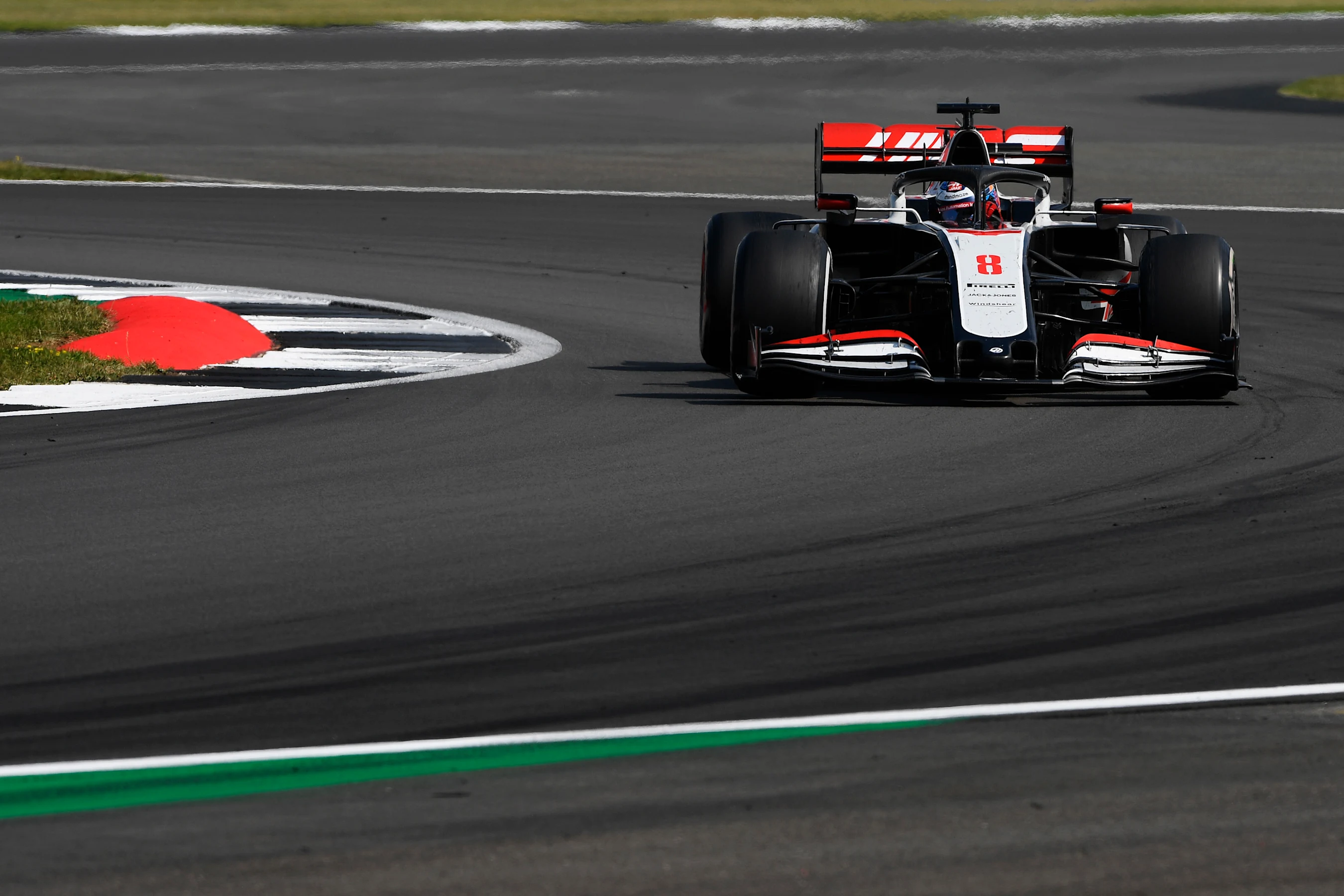 NORTHAMPTON, ENGLAND - AUGUST 09: Romain Grosjean of France driving the (8) Haas F1 Team VF-20