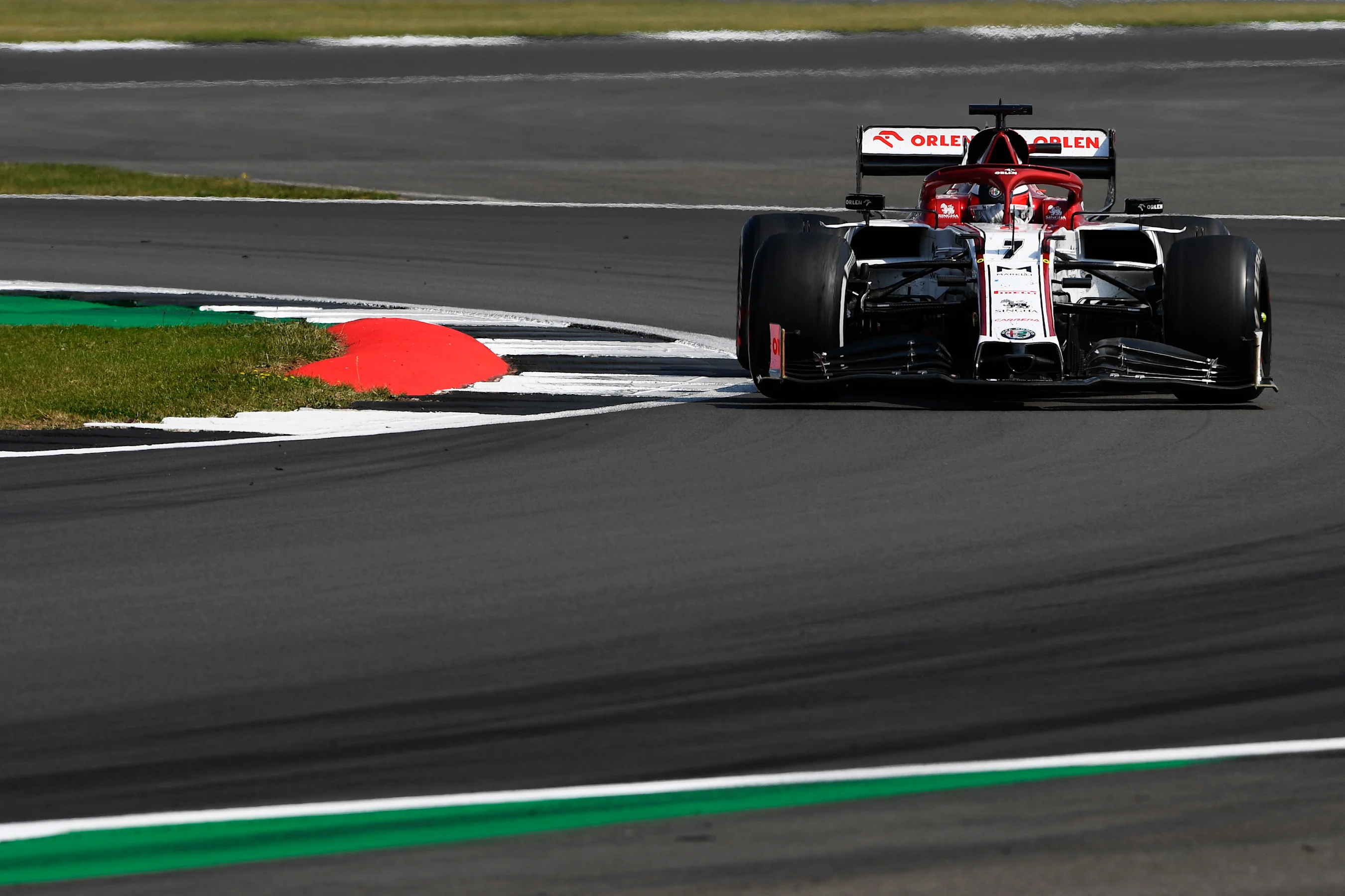 NORTHAMPTON, ENGLAND - AUGUST 09: Kimi Raikkonen of Finland driving the (7) Alfa Romeo Racing C39