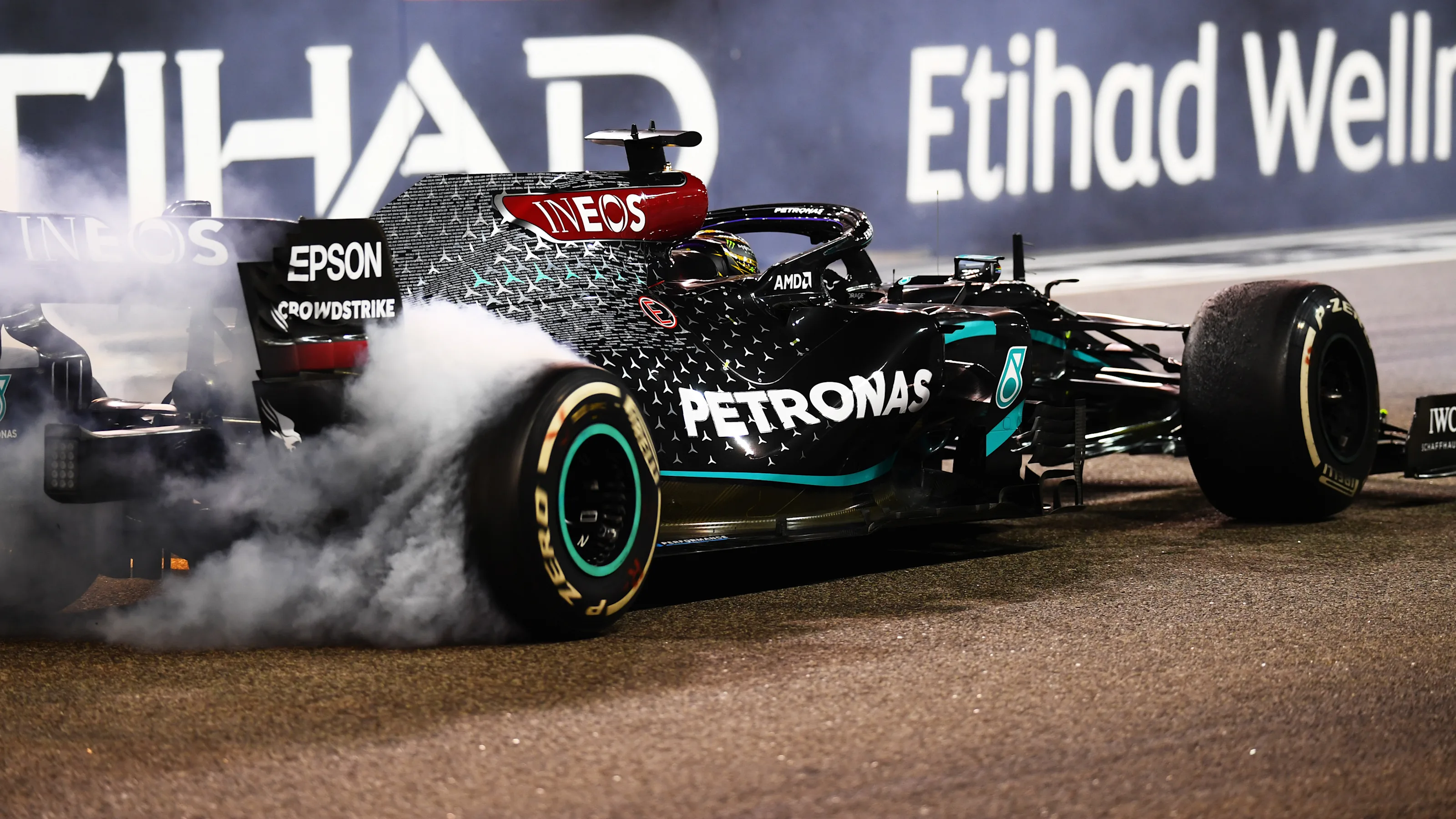 ABU DHABI, UNITED ARAB EMIRATES - DECEMBER 13: Third placed Lewis Hamilton of Great Britain driving