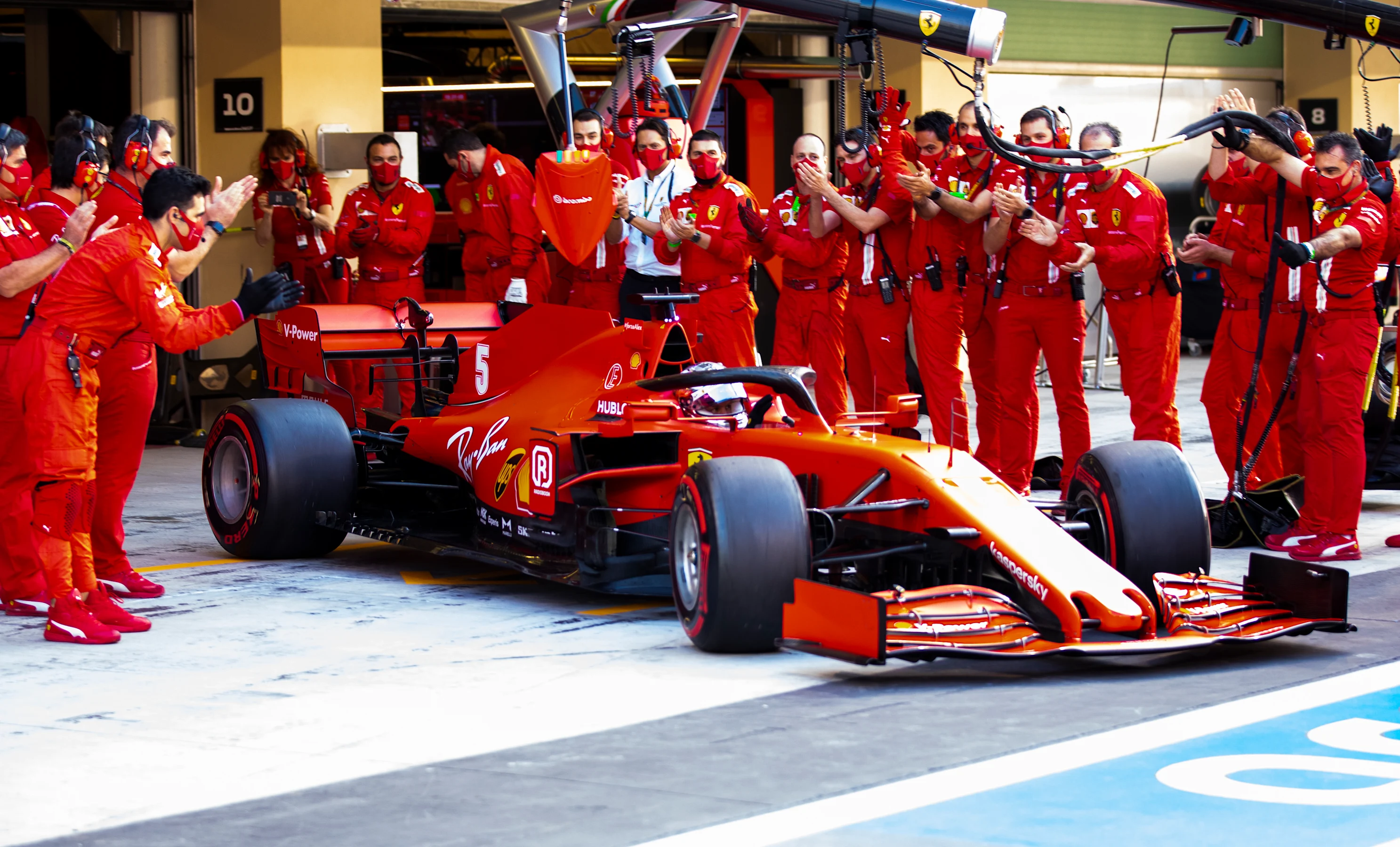 ABU DHABI, UNITED ARAB EMIRATES - DECEMBER 13: The Ferrari team applaud as Sebastian Vettel of