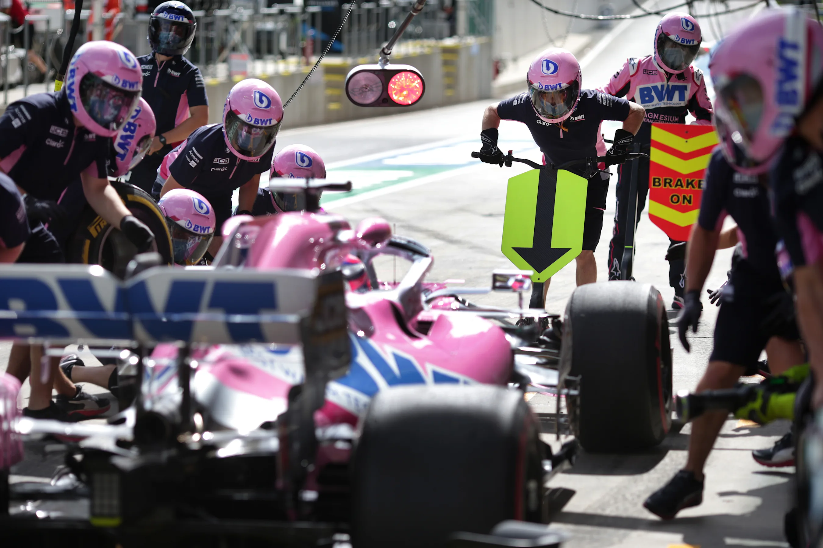 SPIELBERG, AUSTRIA - JULY 03: Racing Point team members prepare for a pit stop during practice for