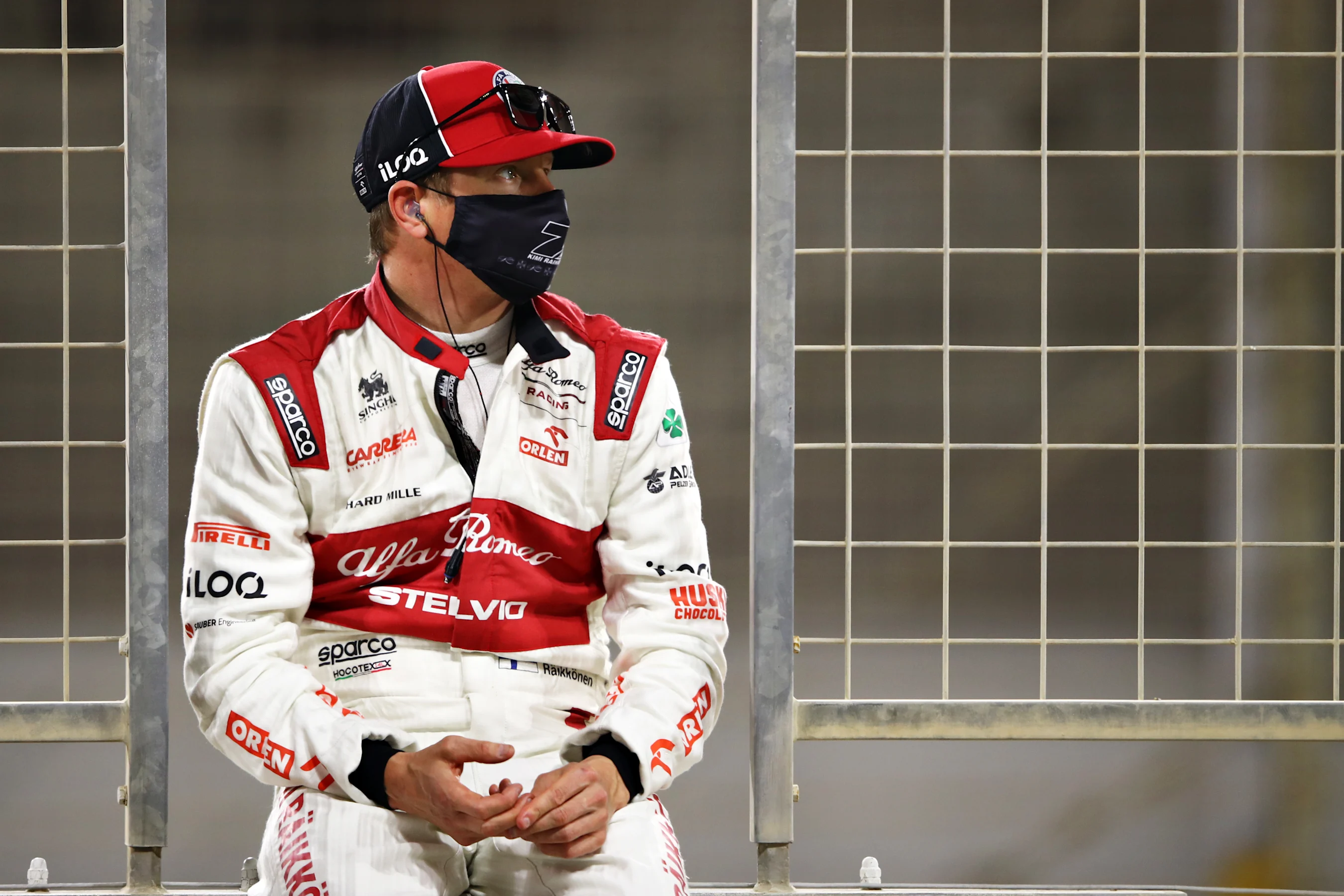 BAHRAIN, BAHRAIN - NOVEMBER 29: Kimi Raikkonen of Finland and Alfa Romeo Racing looks on from the