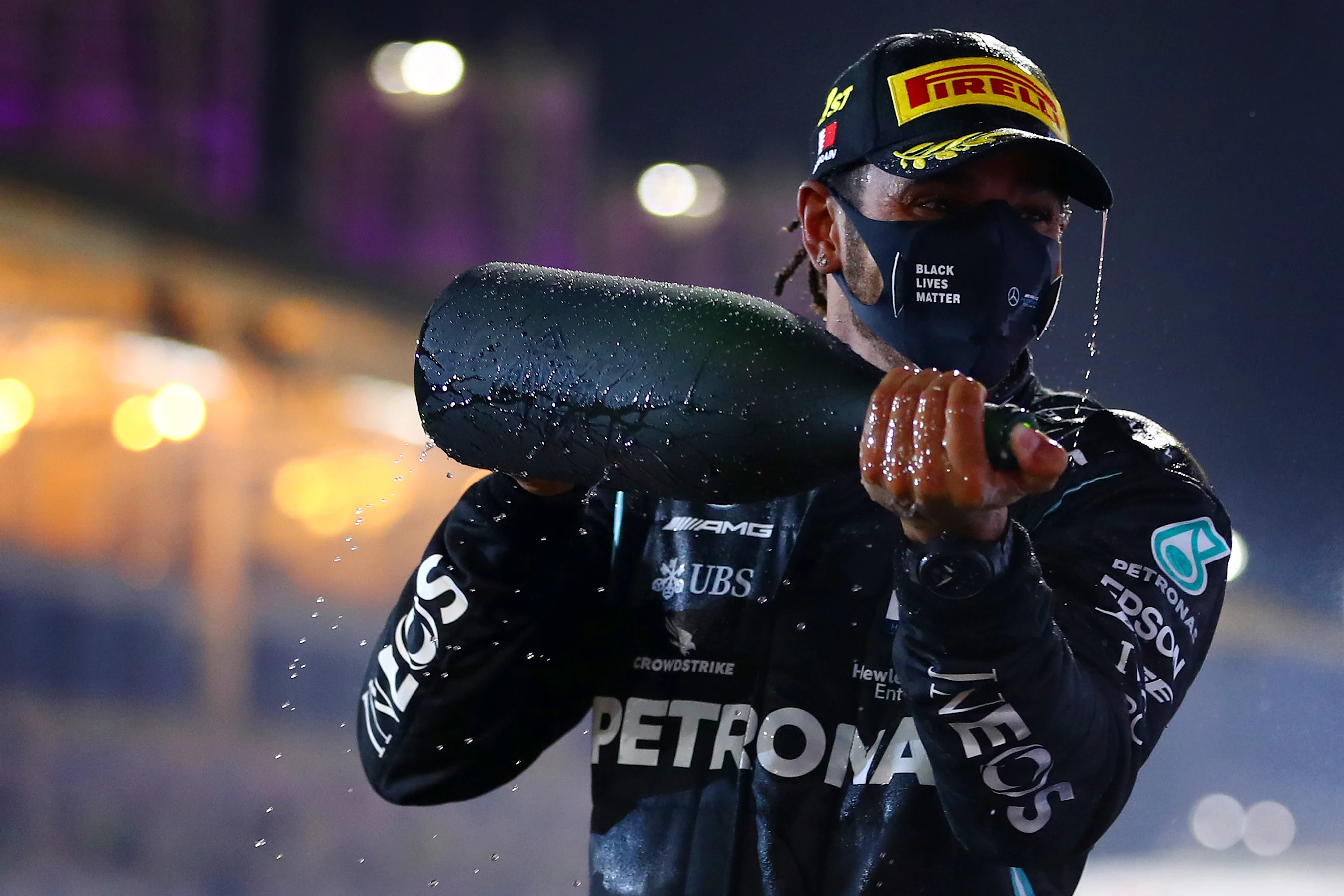 BAHRAIN, BAHRAIN - NOVEMBER 29: Race winner Lewis Hamilton of Great Britain and Mercedes GP