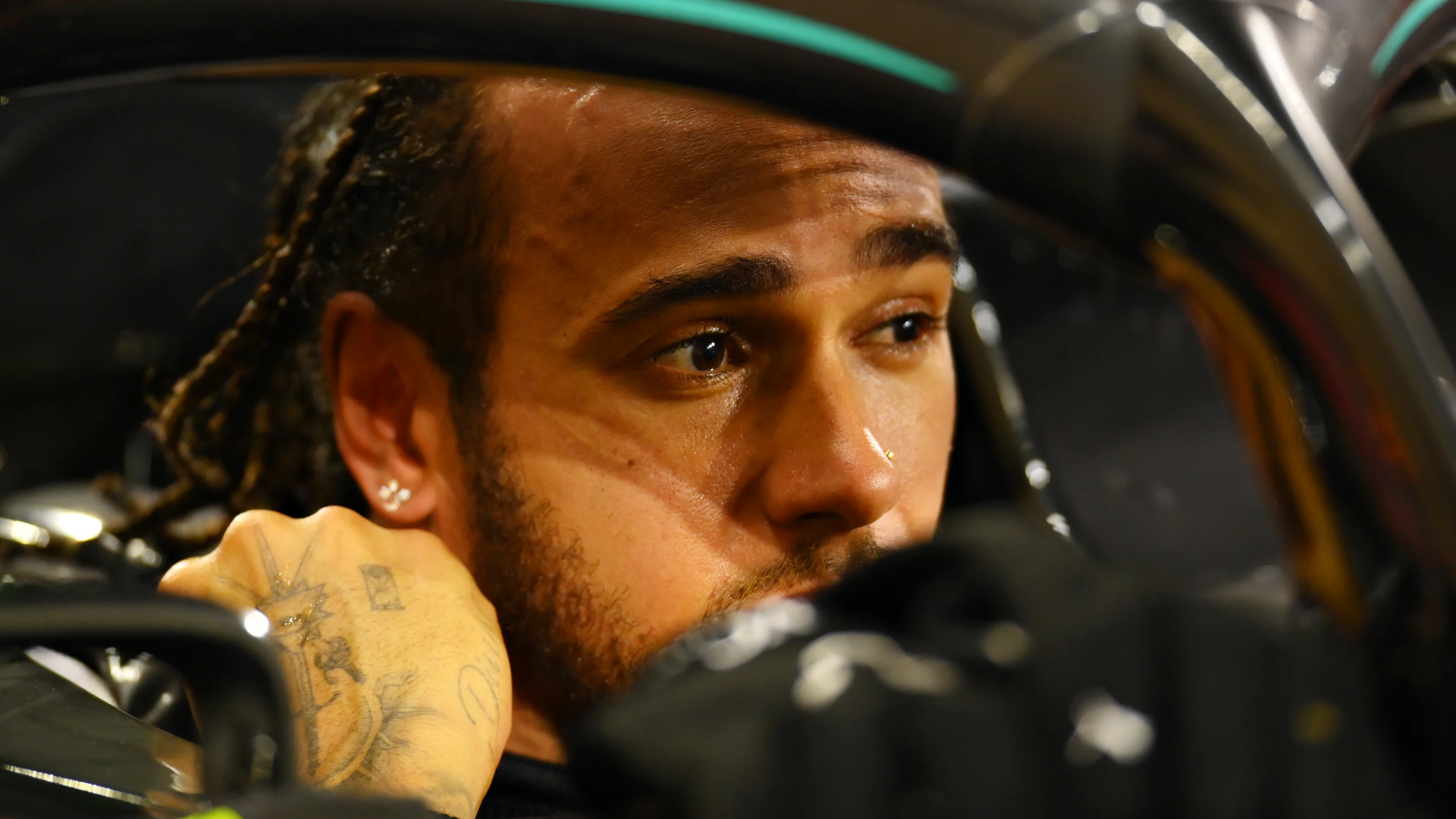 BAHRAIN, BAHRAIN - NOVEMBER 29: Race winner Lewis Hamilton of Great Britain and Mercedes GP stops