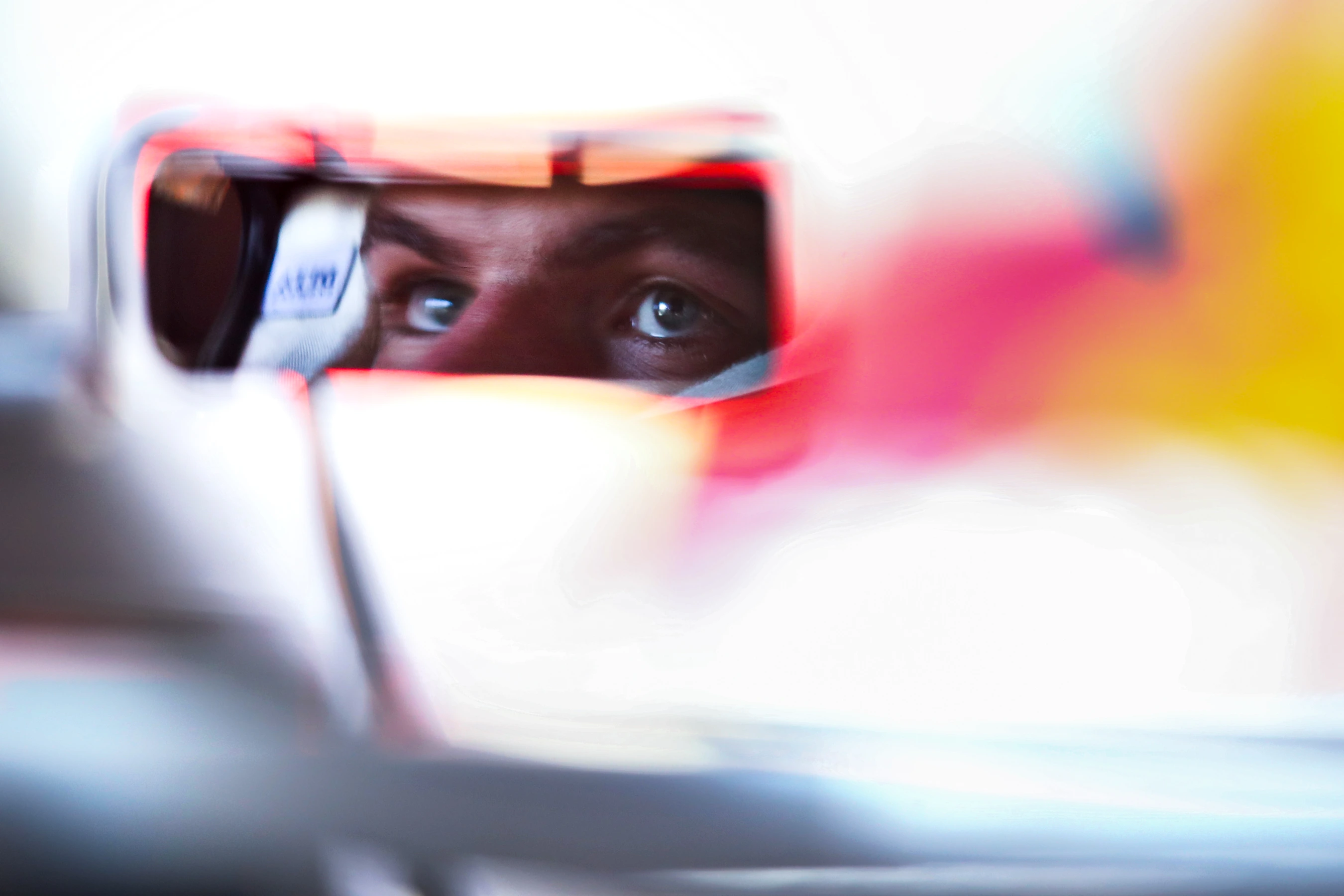 NUERBURG, GERMANY - OCTOBER 10: A reflection in the wing mirror as Max Verstappen of Netherlands