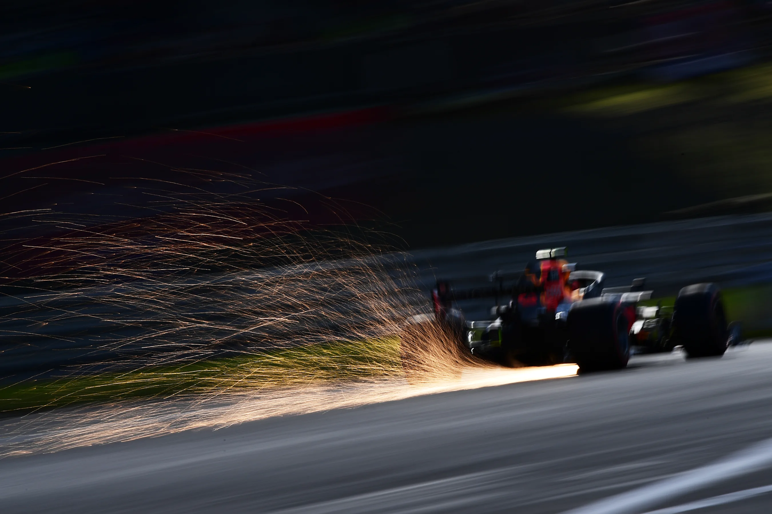 NUERBURG, GERMANY - OCTOBER 10: Sparks fly behind Max Verstappen of the Netherlands driving the