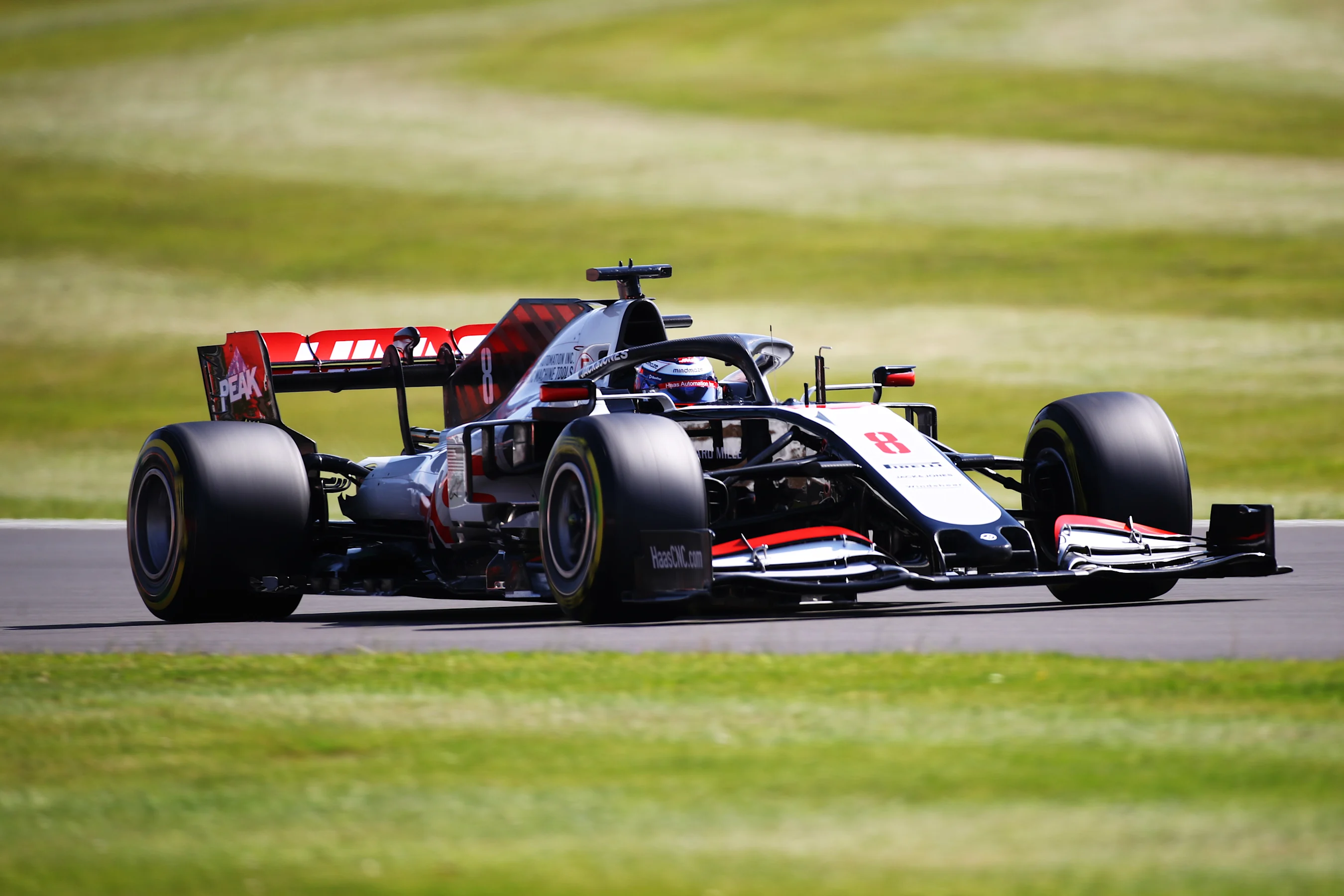 NORTHAMPTON, ENGLAND - JULY 31: Romain Grosjean of France driving the (8) Haas F1 Team VF-20