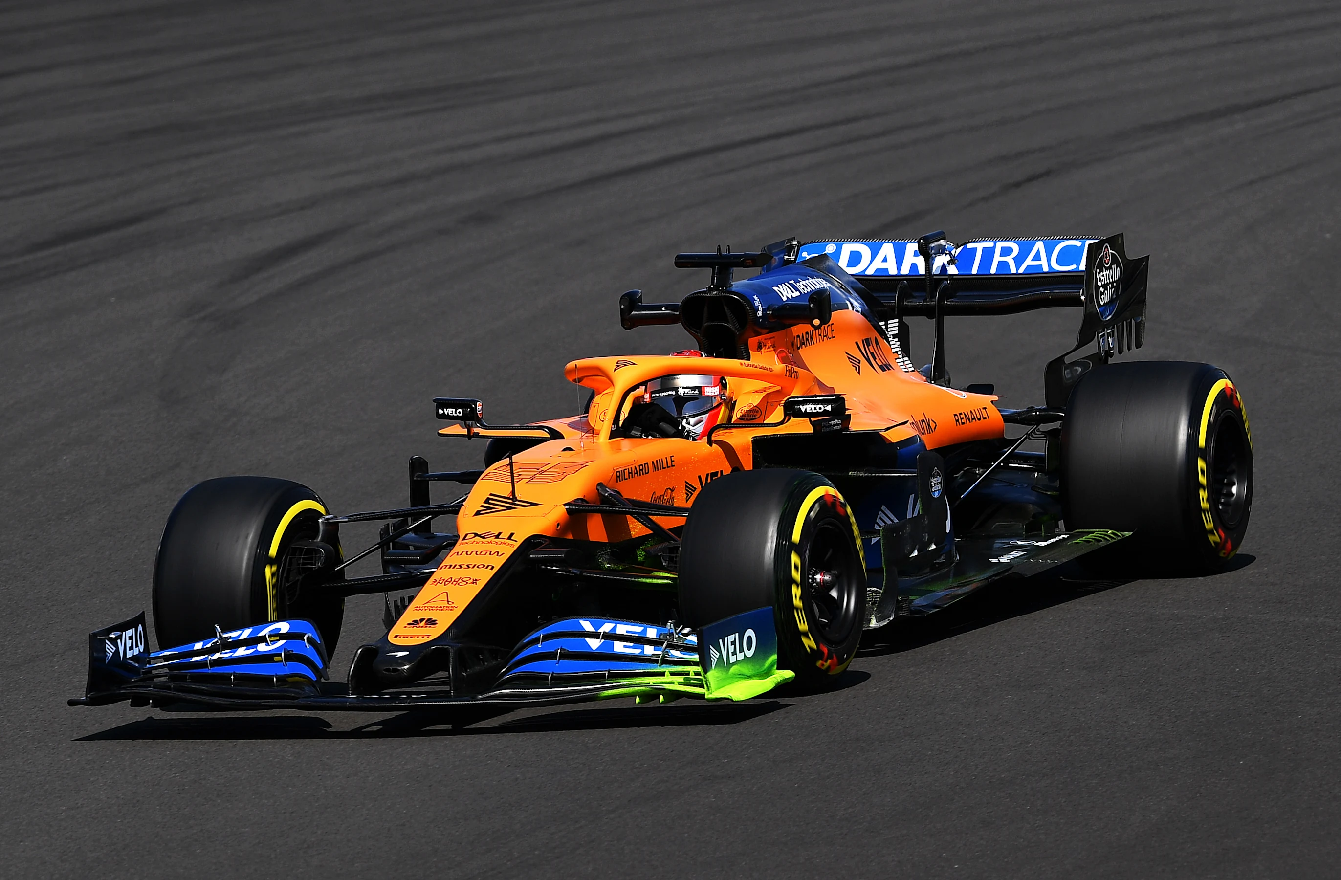 NORTHAMPTON, ENGLAND - JULY 31: Carlos Sainz of Spain driving the (55) McLaren F1 Team MCL35