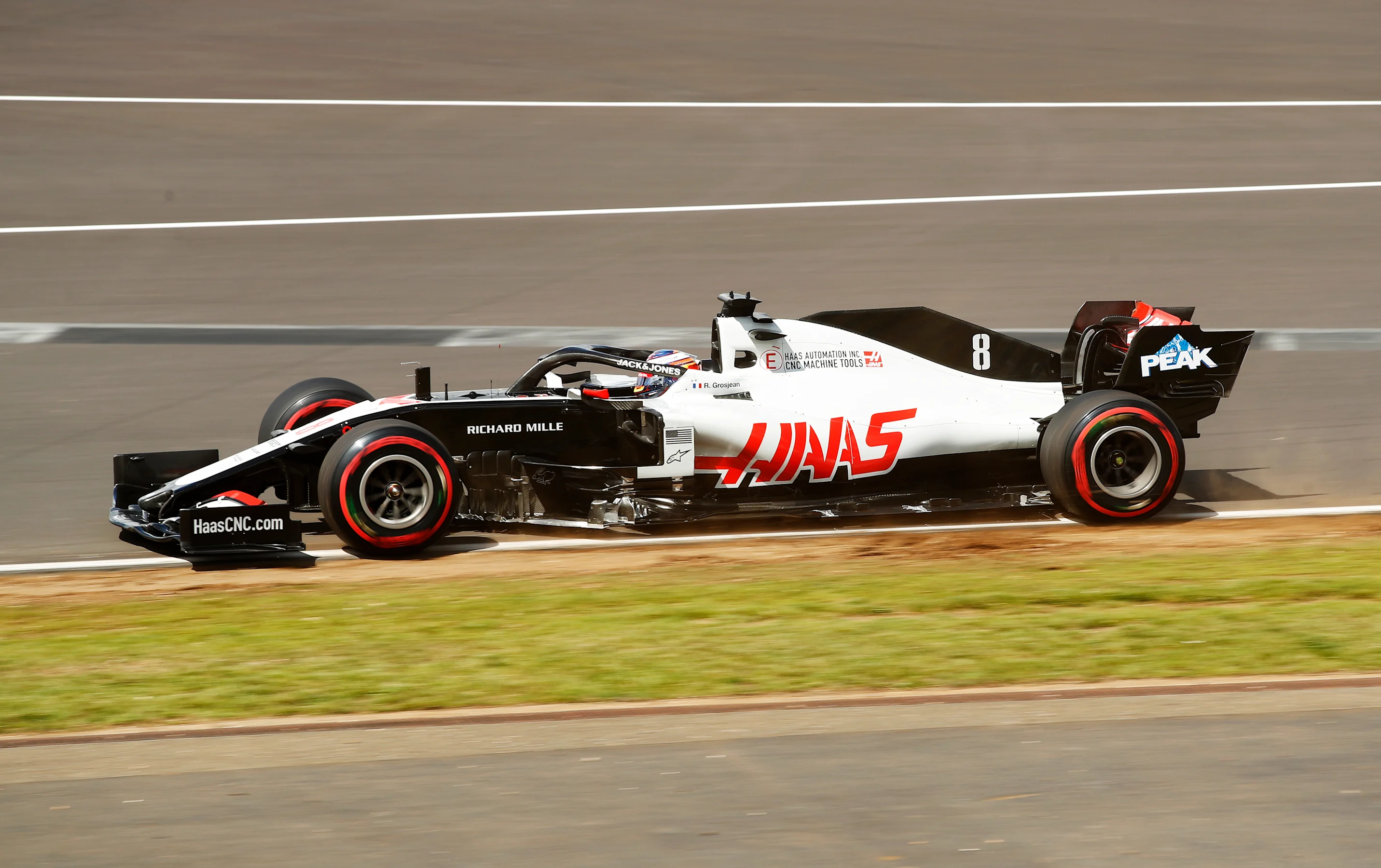 NORTHAMPTON, ENGLAND - AUGUST 01: Romain Grosjean of France driving the (8) Haas F1 Team VF-20