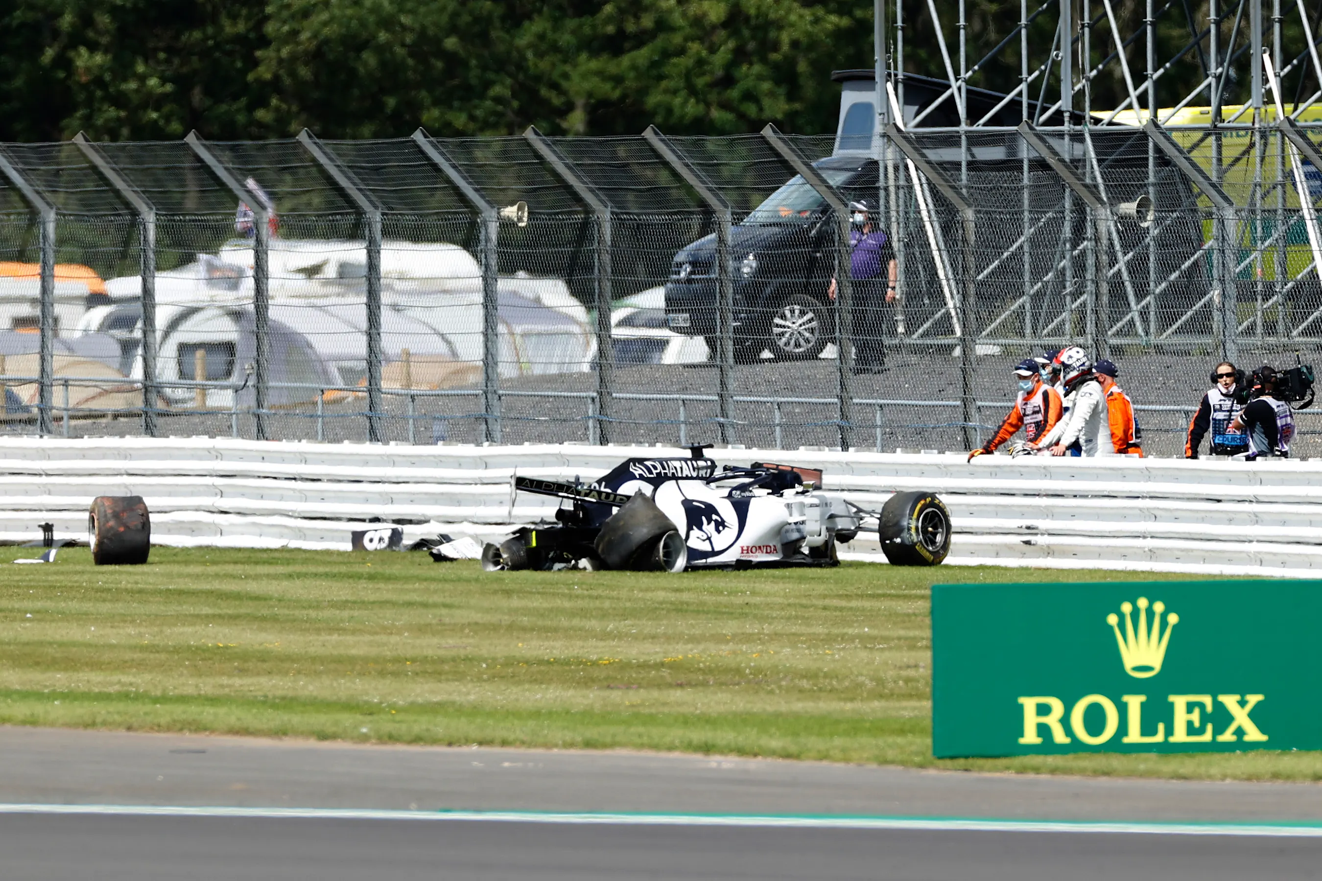NORTHAMPTON, ENGLAND - AUGUST 02: Daniil Kvyat of Russia and Scuderia AlphaTauri looks at his car