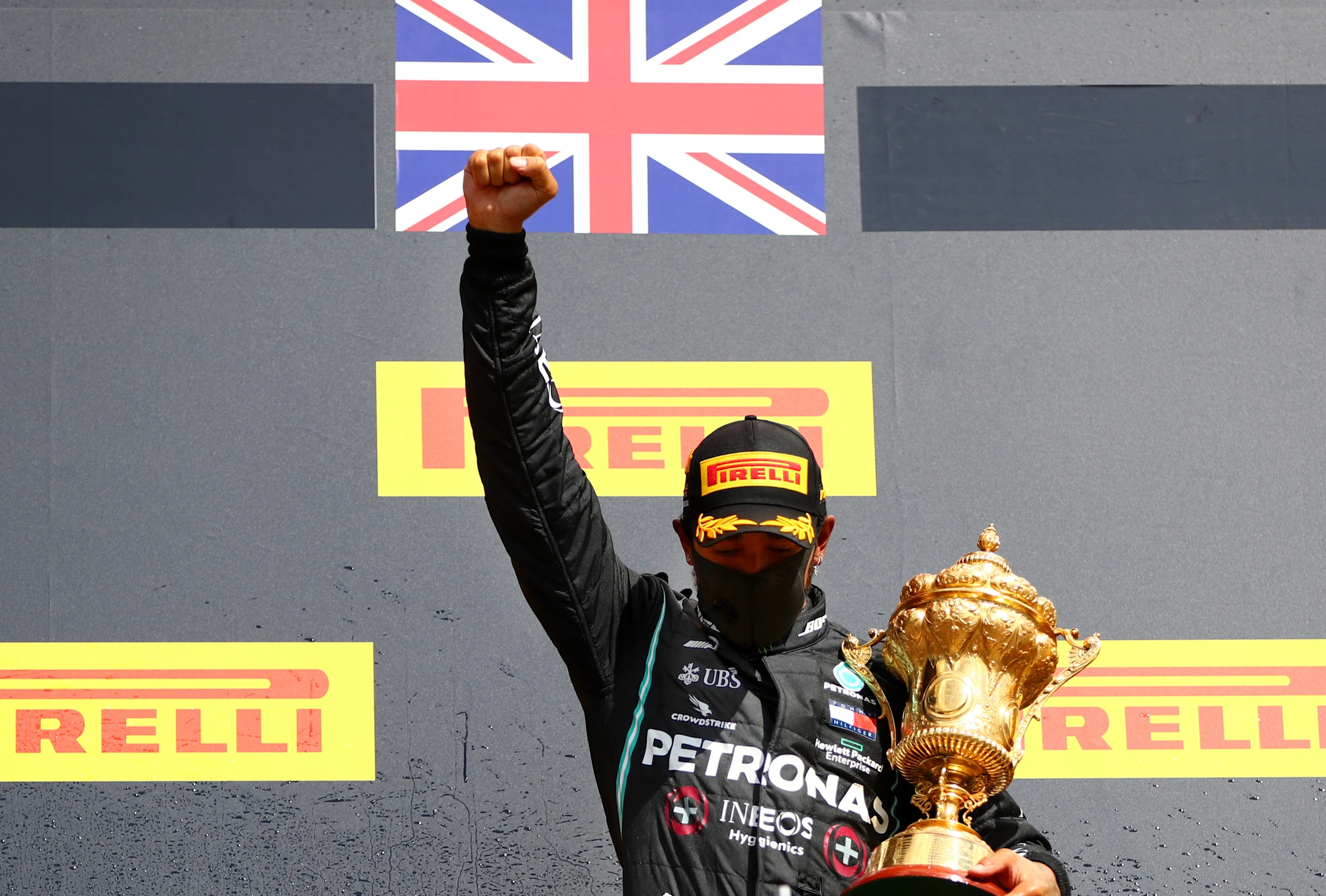 NORTHAMPTON, ENGLAND - AUGUST 02: Lewis Hamilton of Great Britain and Mercedes GP raises his fist