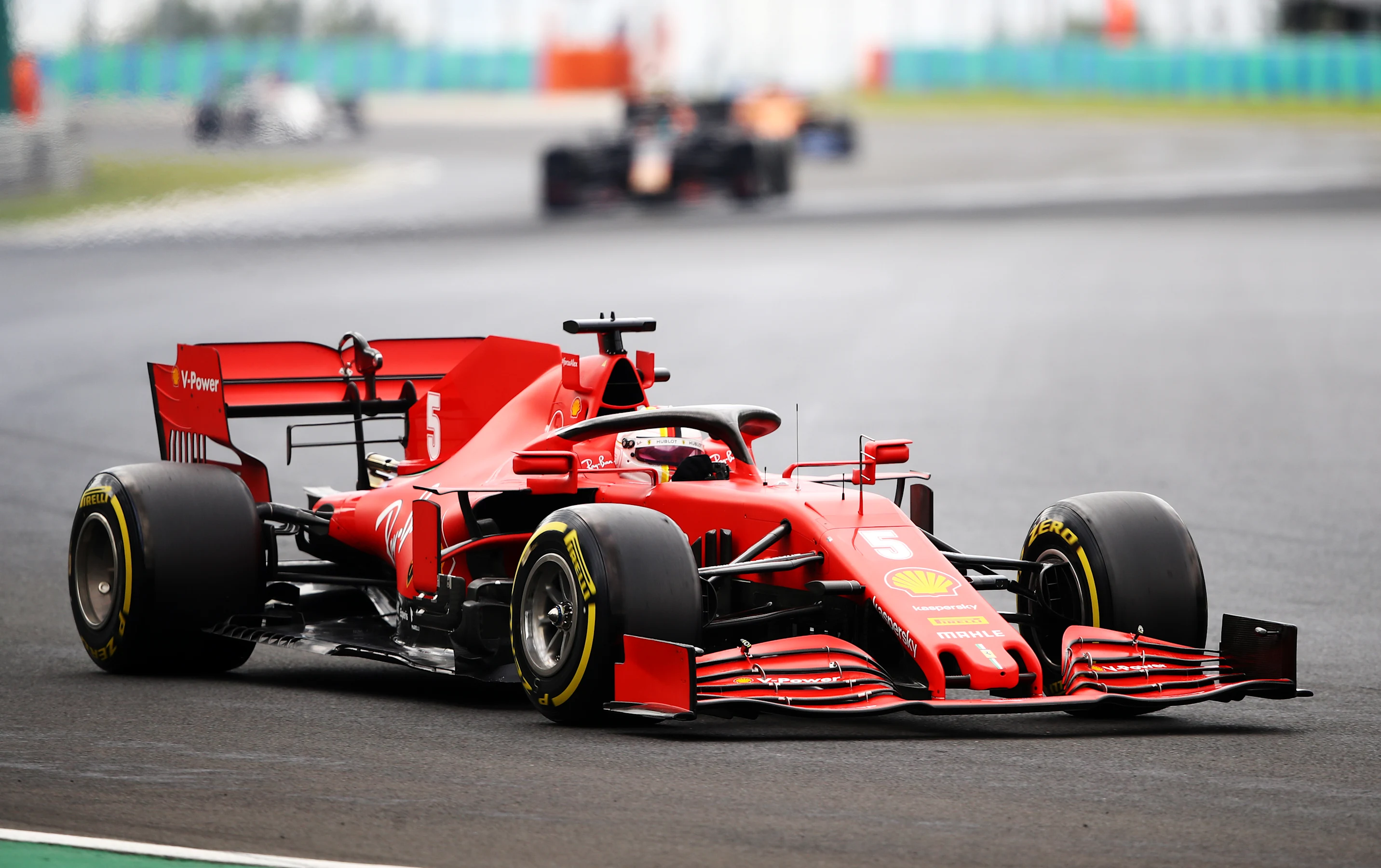 BUDAPEST, HUNGARY - JULY 19: Sebastian Vettel of Germany driving the (5) Scuderia Ferrari SF1000 on