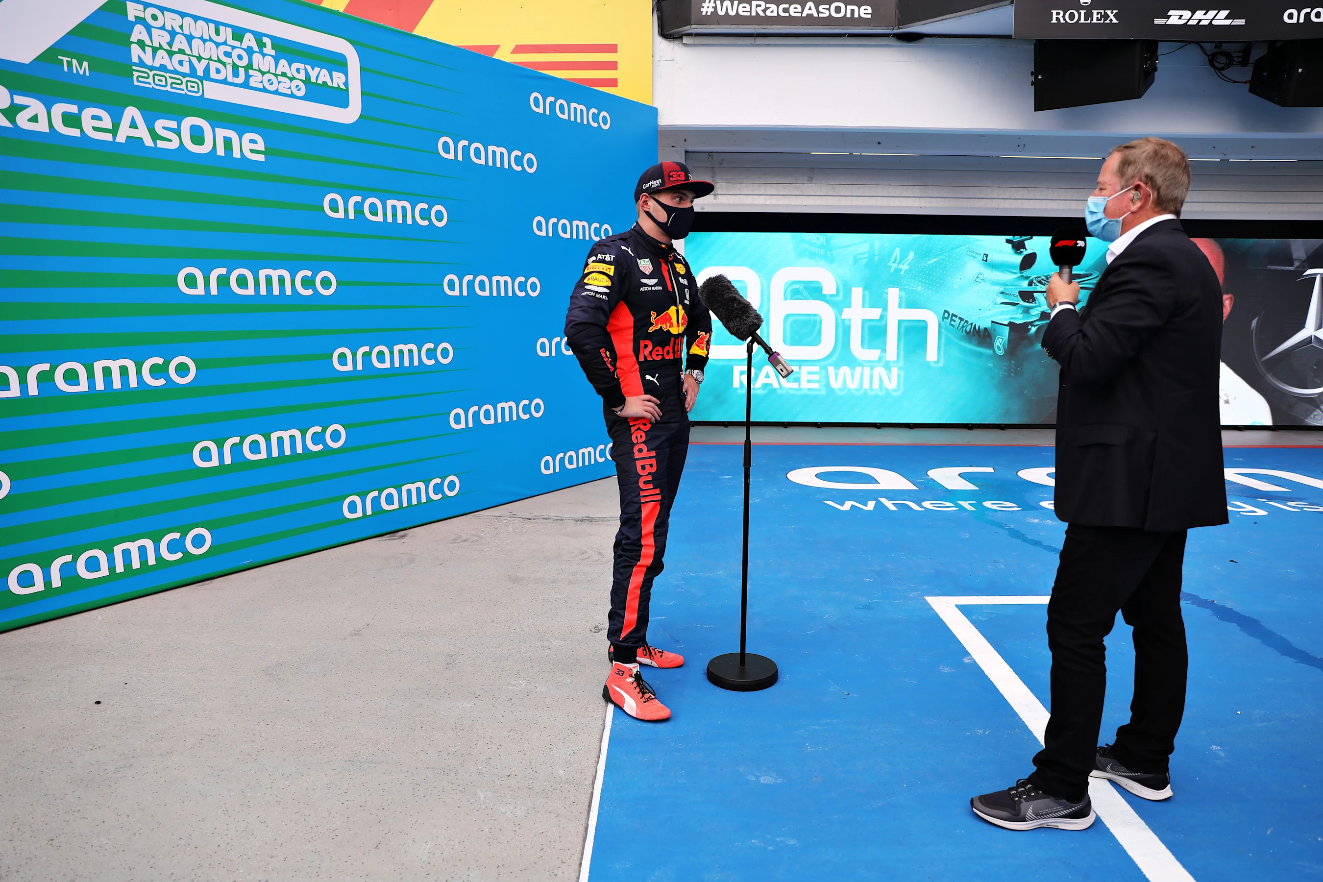 BUDAPEST, HUNGARY - JULY 19: Second placed Max Verstappen of Netherlands and Red Bull Racing talks