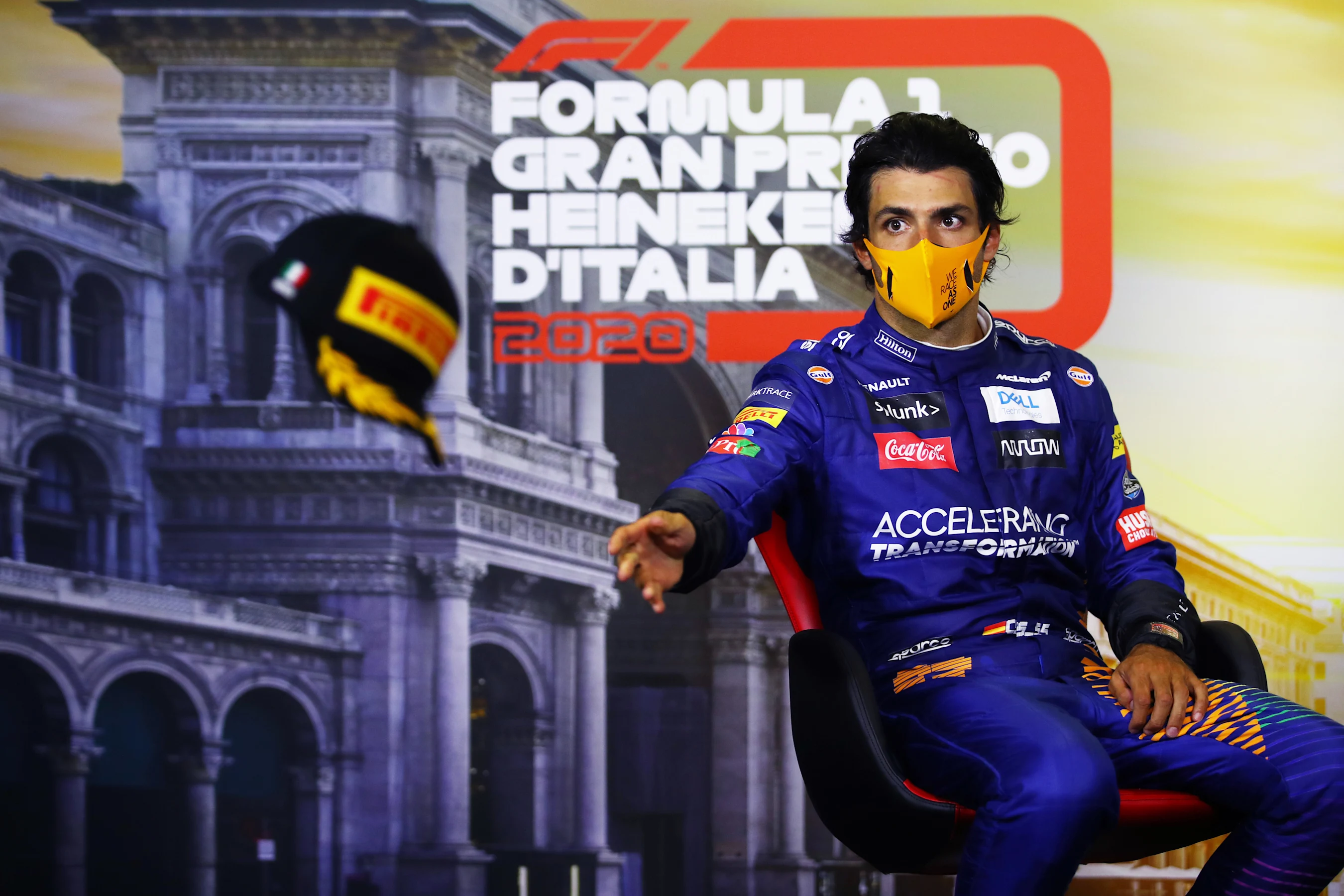 MONZA, ITALY - SEPTEMBER 06: Second placed Carlos Sainz of Spain and McLaren F1 changes his hat in