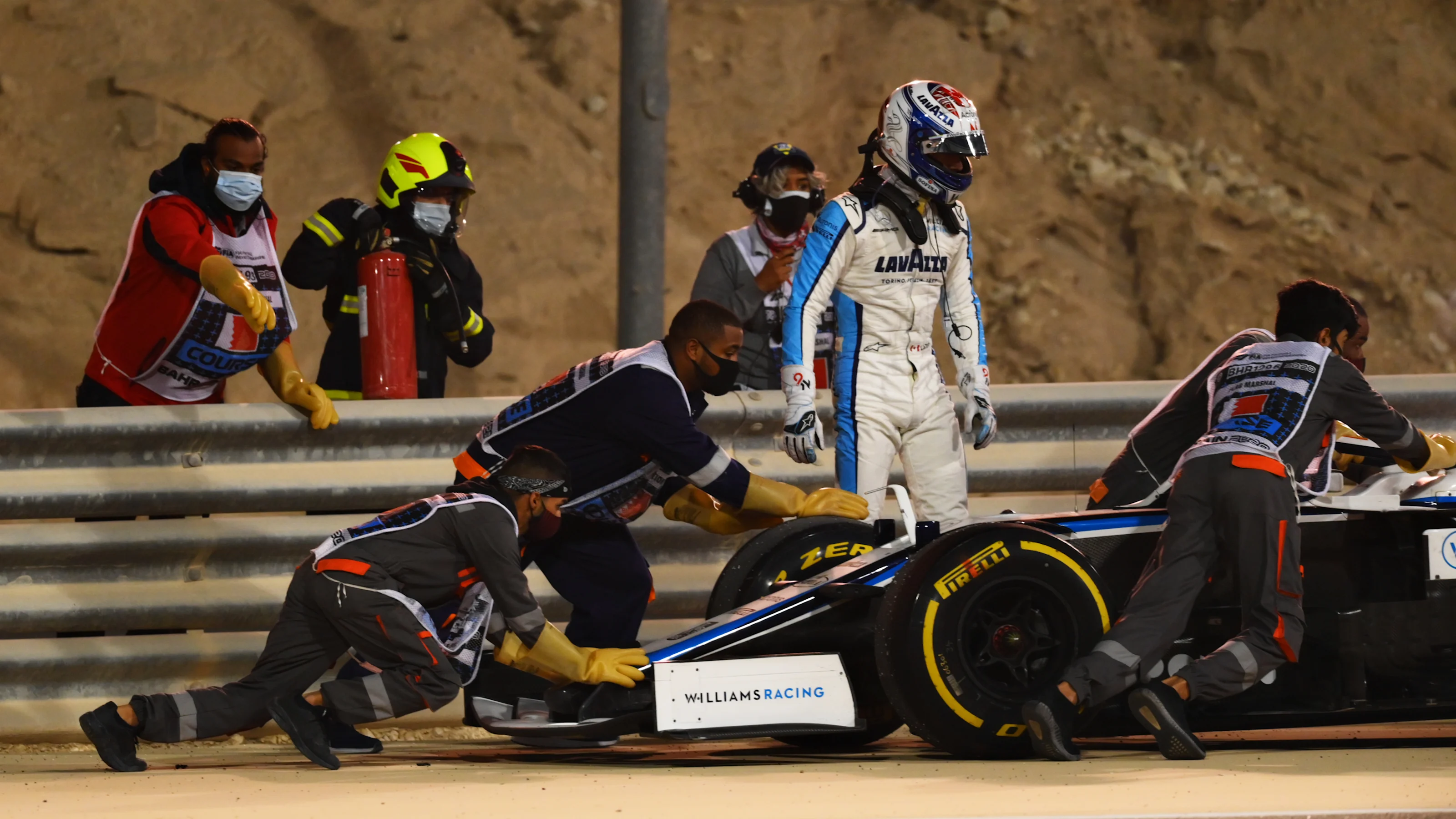 BAHRAIN, BAHRAIN - DECEMBER 06: Nicholas Latifi of Canada and Williams looks on as his car is taken