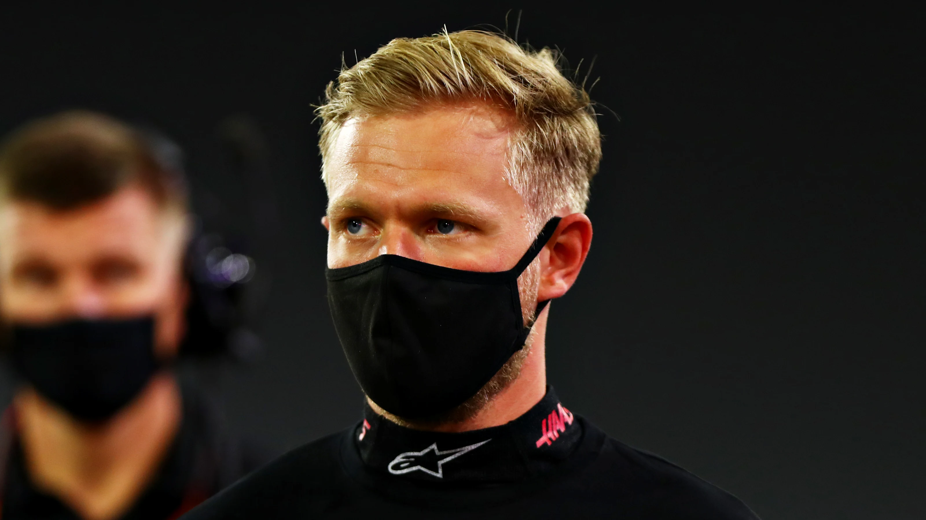 BAHRAIN, BAHRAIN - DECEMBER 06: Kevin Magnussen of Denmark and Haas F1 looks on on the grid during