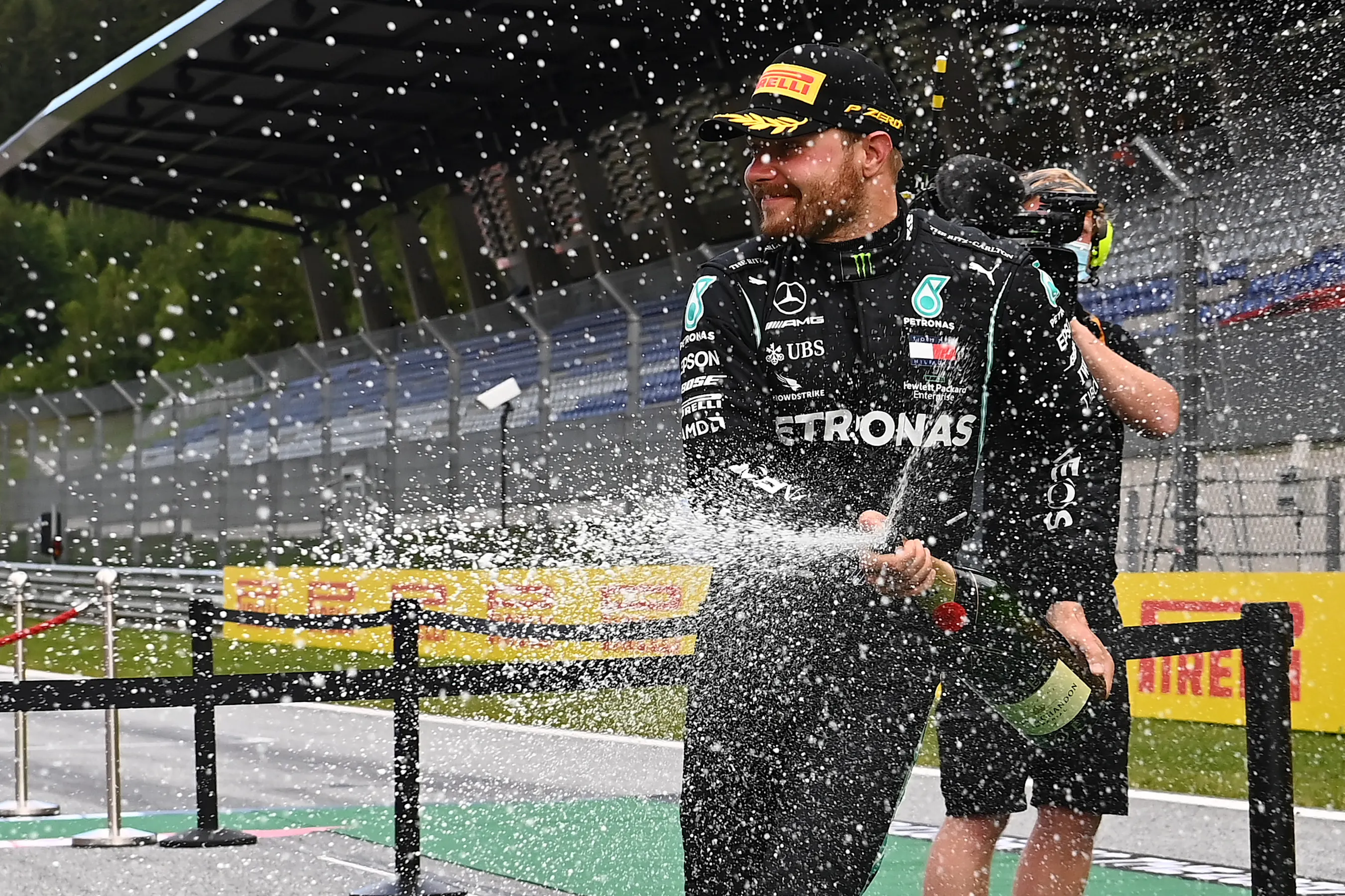 SPIELBERG, AUSTRIA - JULY 12: Second placed Valtteri Bottas of Finland and Mercedes GP celebrates