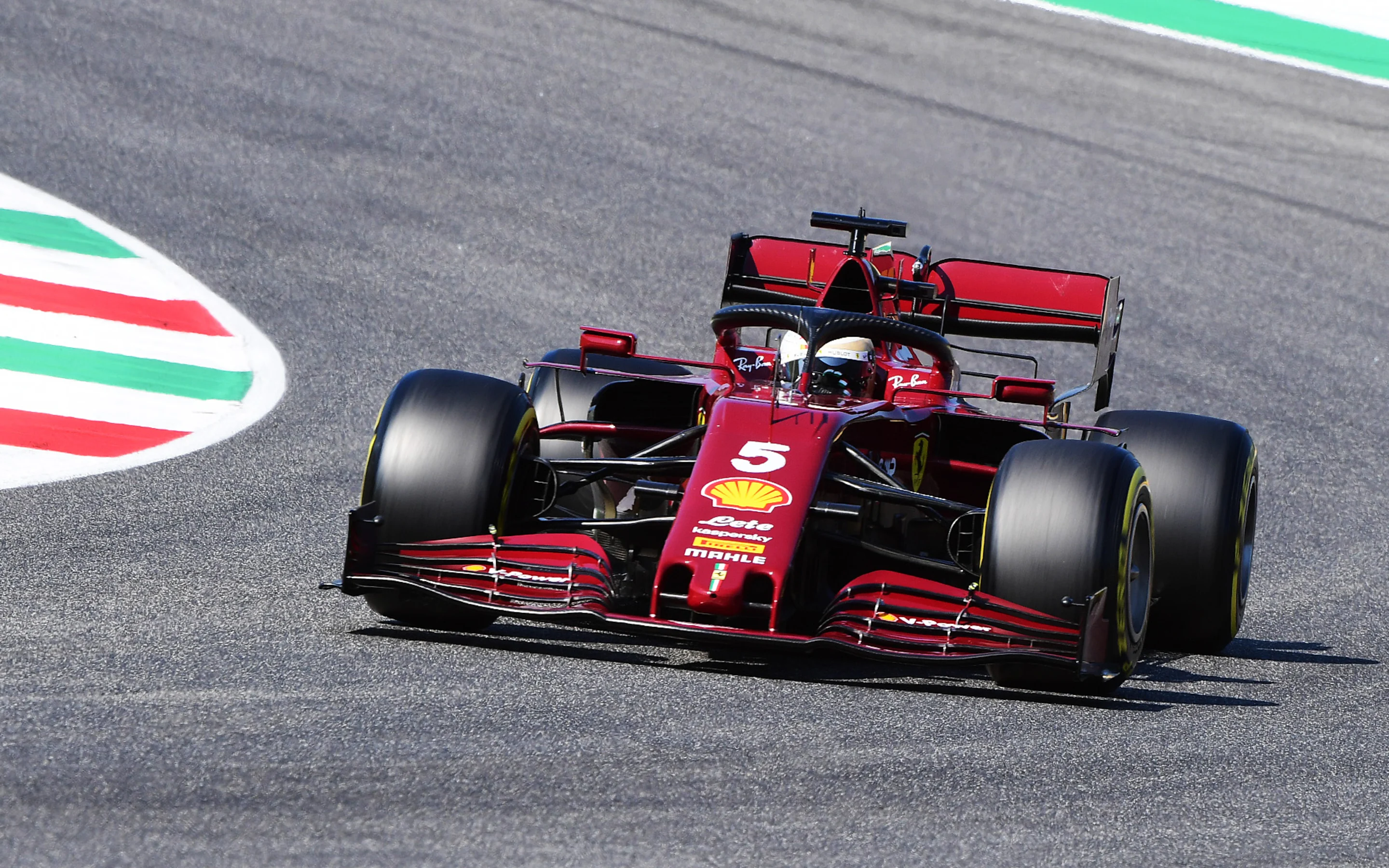 SCARPERIA, ITALY - SEPTEMBER 13: Sebastian Vettel of Germany driving the (5) Scuderia Ferrari