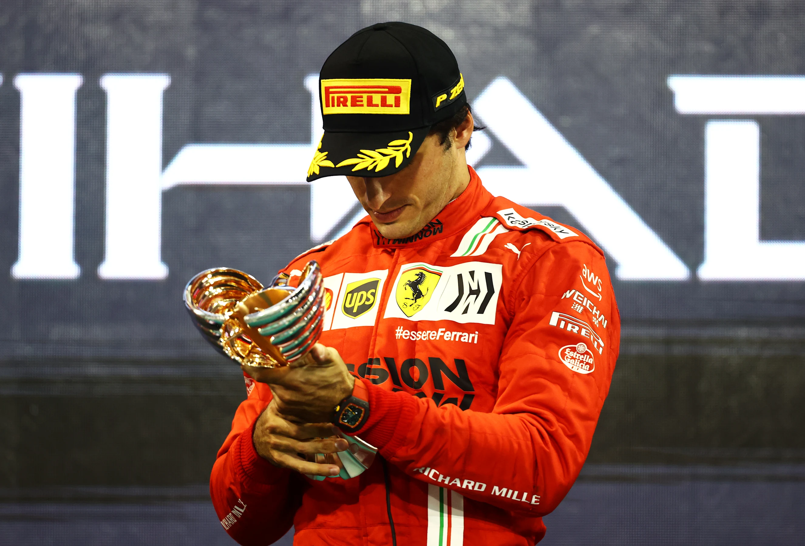 ABU DHABI, UNITED ARAB EMIRATES - DECEMBER 12: Third placed Carlos Sainz of Spain and Ferrari