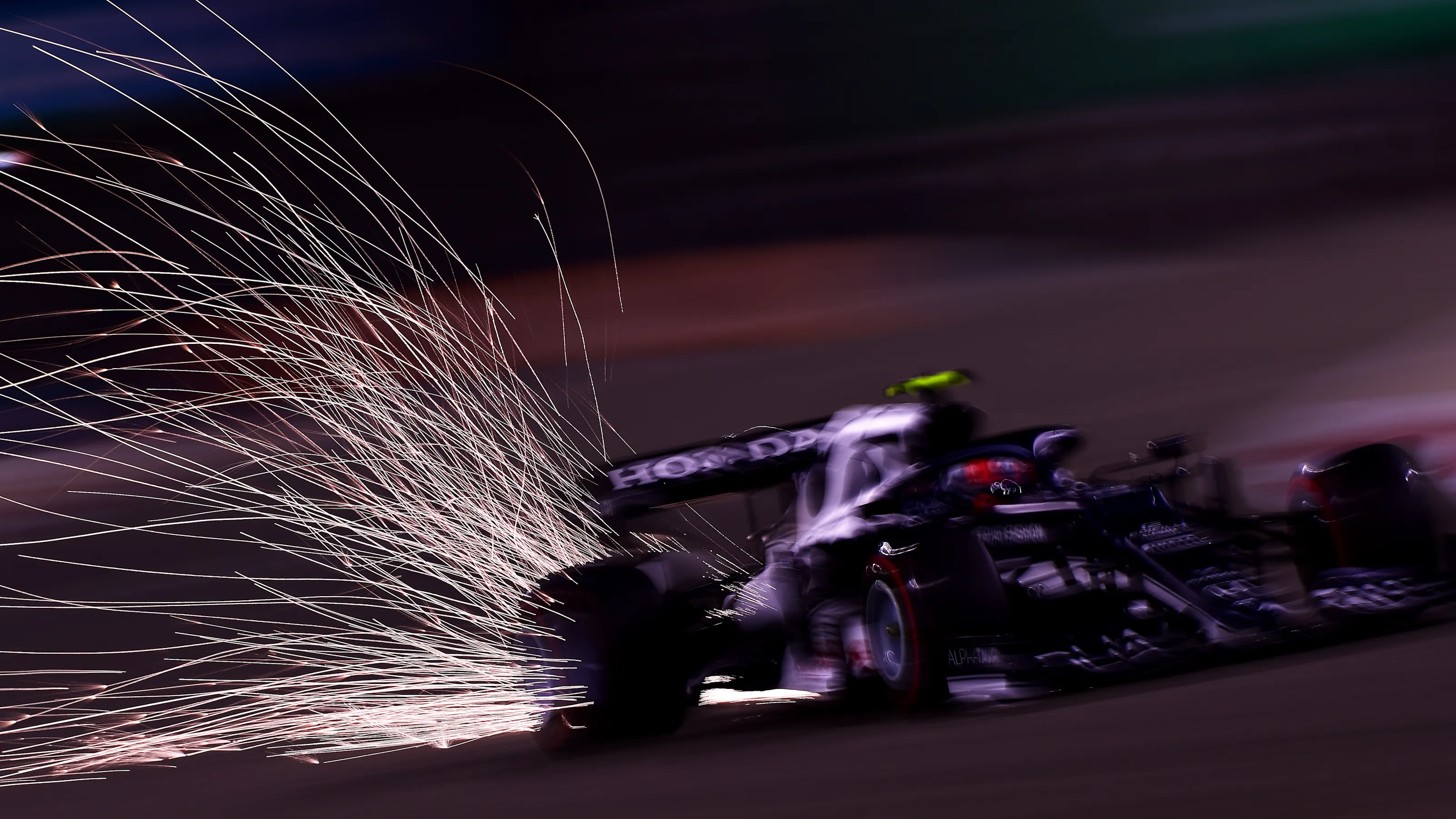 BAHRAIN, BAHRAIN - MARCH 26: Sparks fly behind Pierre Gasly of France driving the (10) Scuderia