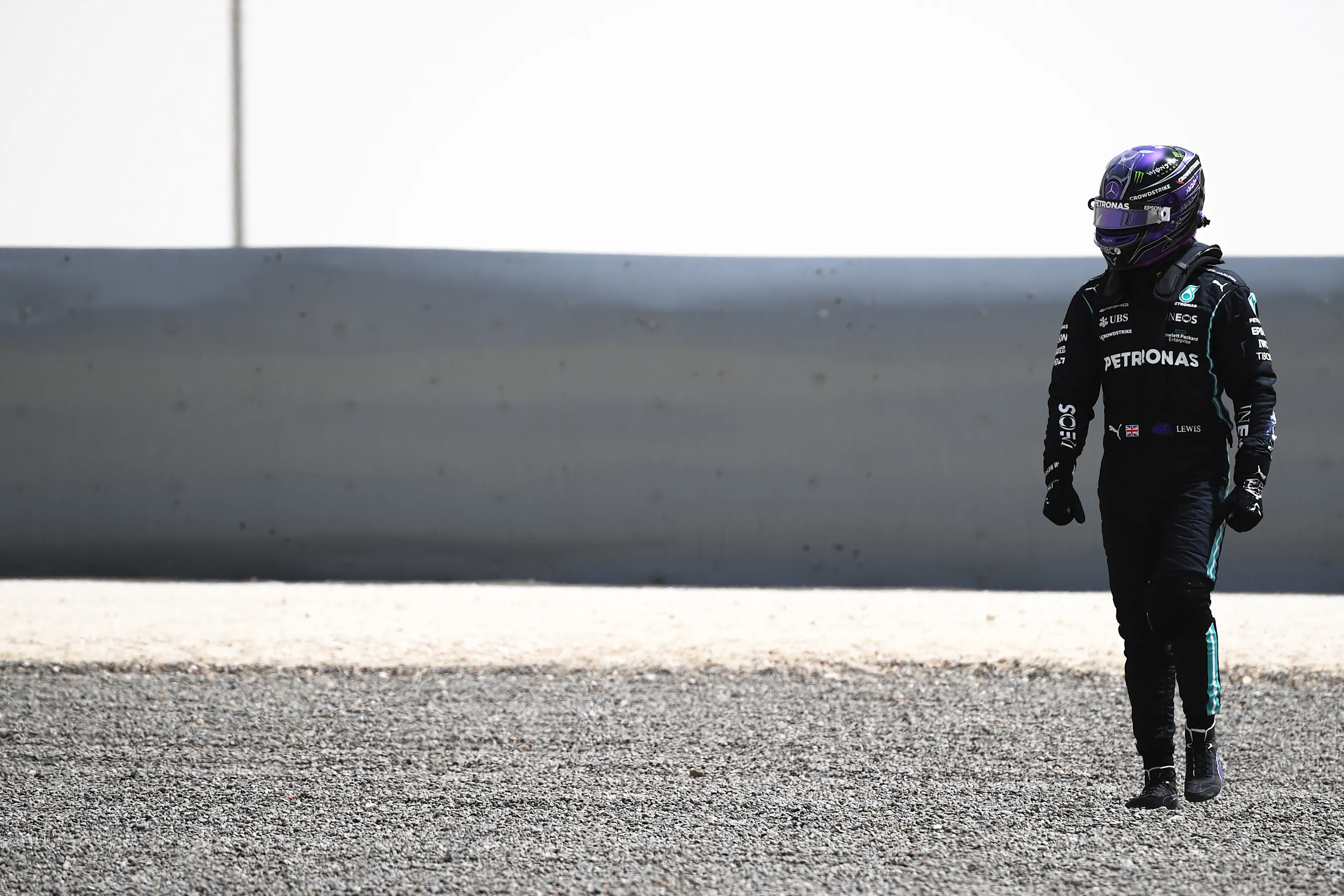 BAHRAIN, BAHRAIN - MARCH 13: Lewis Hamilton of Great Britain and Mercedes GP looks dejected after