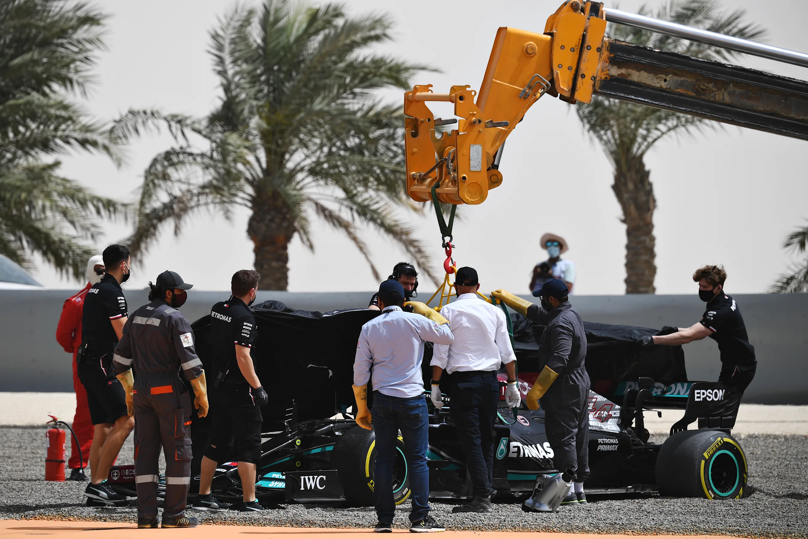 BAHRAIN, BAHRAIN - MARCH 13: The car of Lewis Hamilton of Great Britain and Mercedes GP is removed