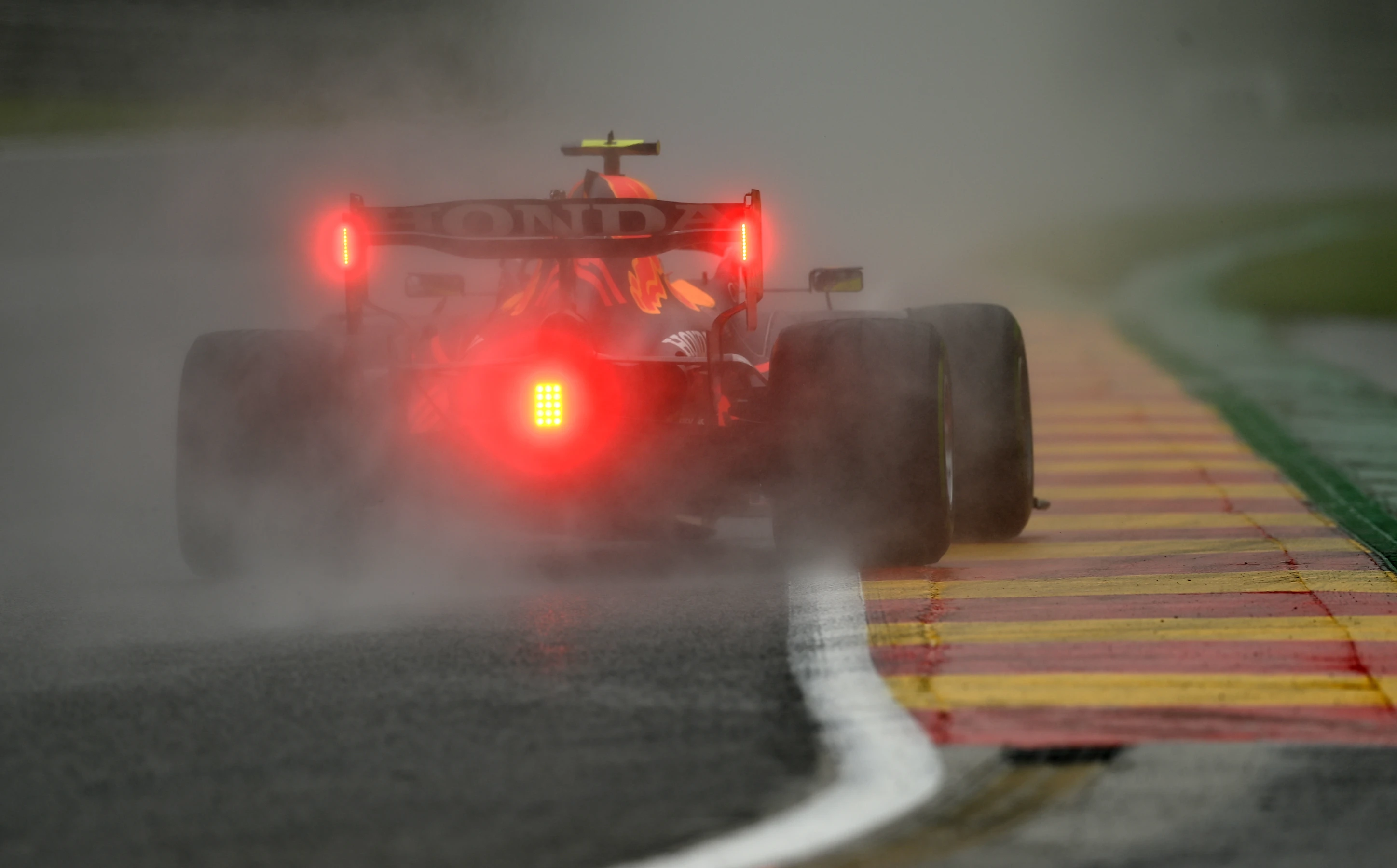 SPA, BELGIUM - AUGUST 28: Sergio Perez of Mexico driving the (11) Red Bull Racing RB16B Honda