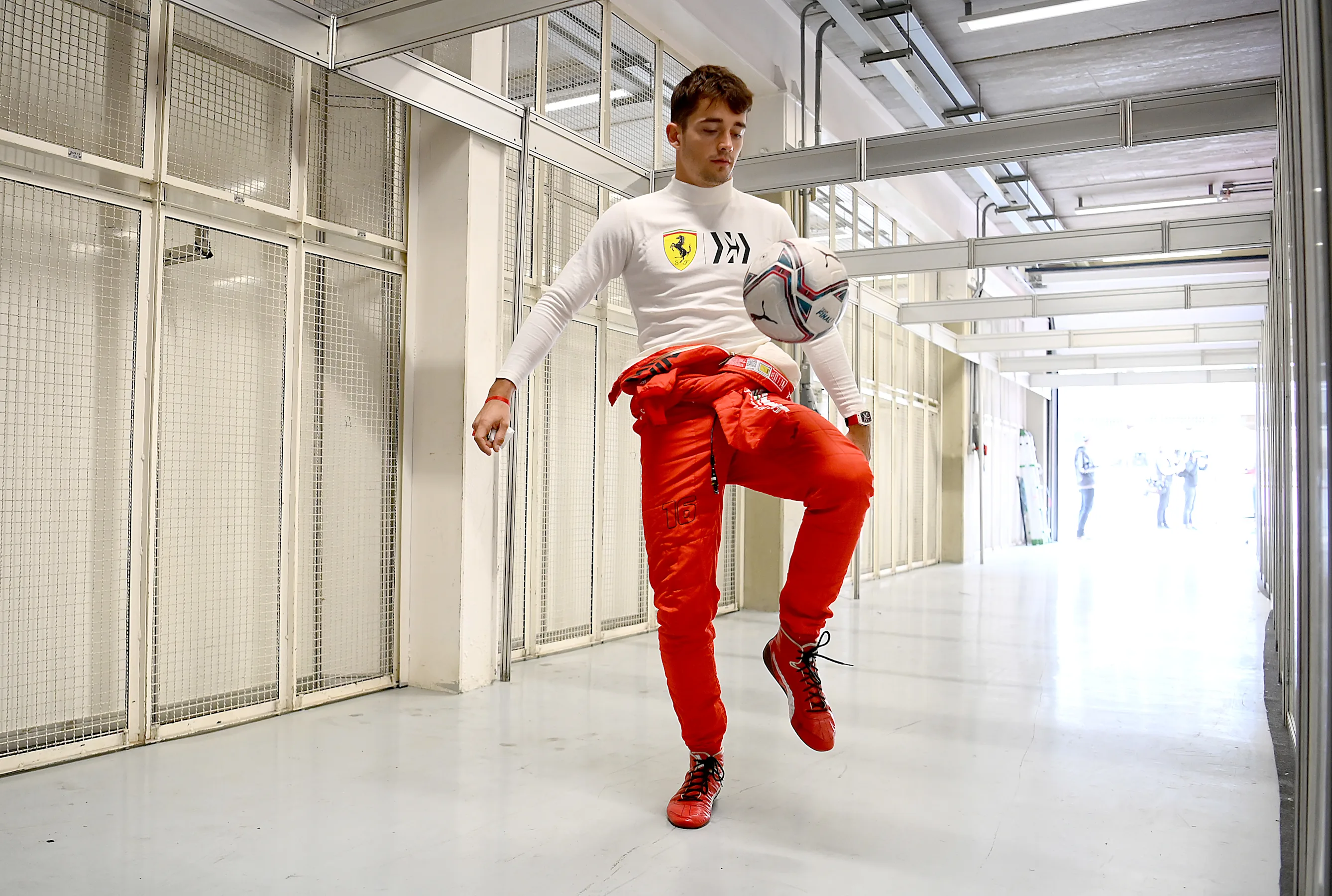 SAO PAULO, BRAZIL - NOVEMBER 12: Charles Leclerc of Monaco and Ferrari warms up by playing football