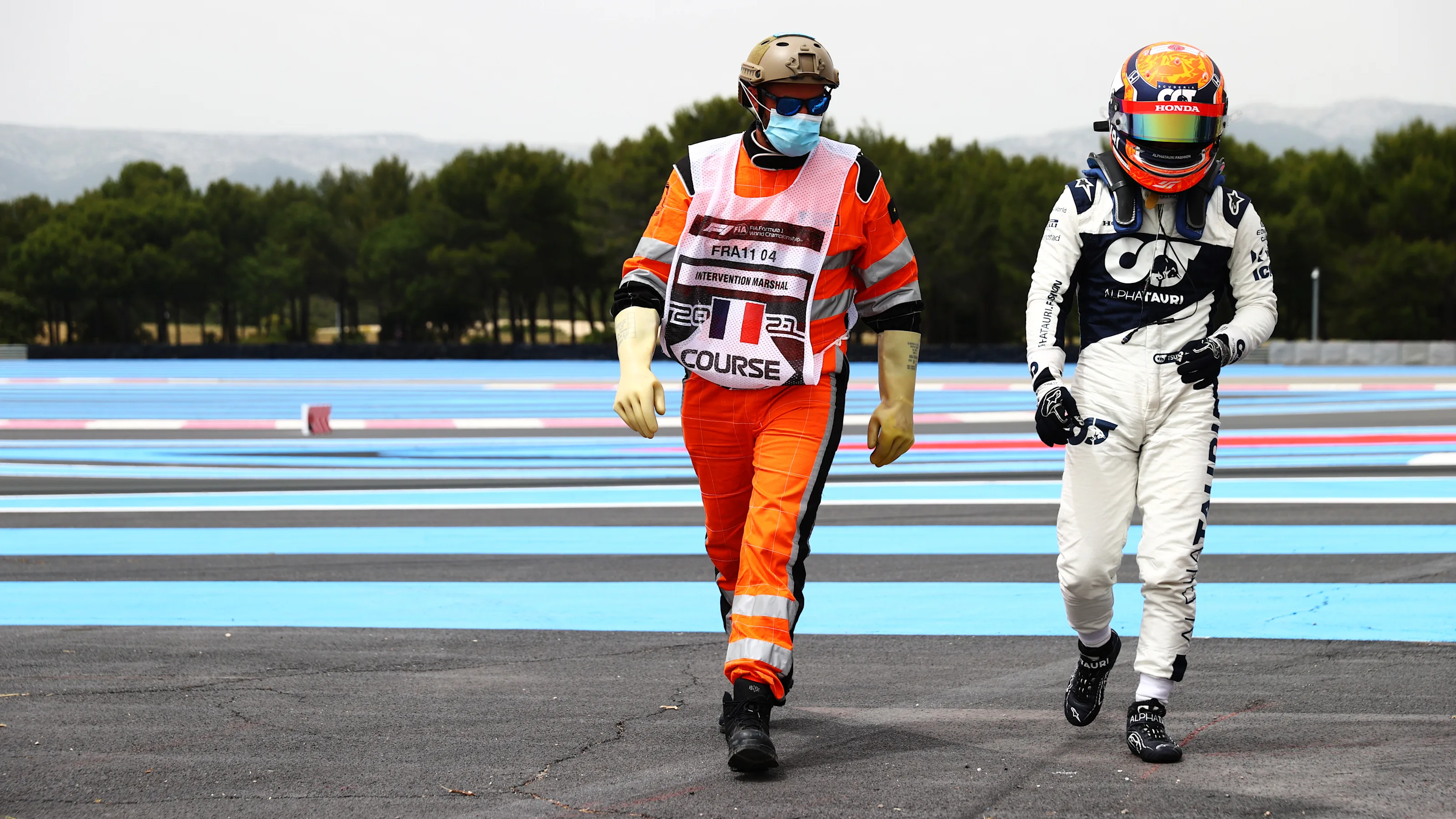 LE CASTELLET, FRANCE - JUNE 19: Yuki Tsunoda of Japan and Scuderia AlphaTauri walks off the circuit