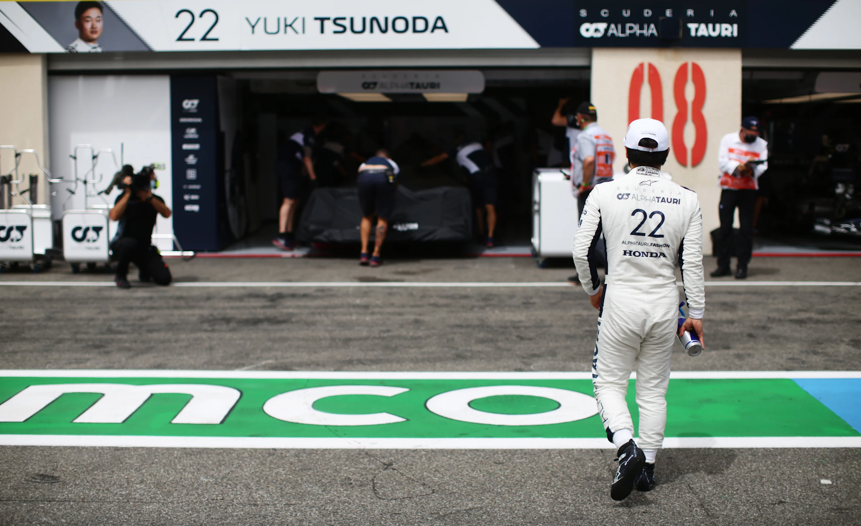 LE CASTELLET, FRANCE - JUNE 19: Yuki Tsunoda of Japan and Scuderia AlphaTauri walks in the Pitlane