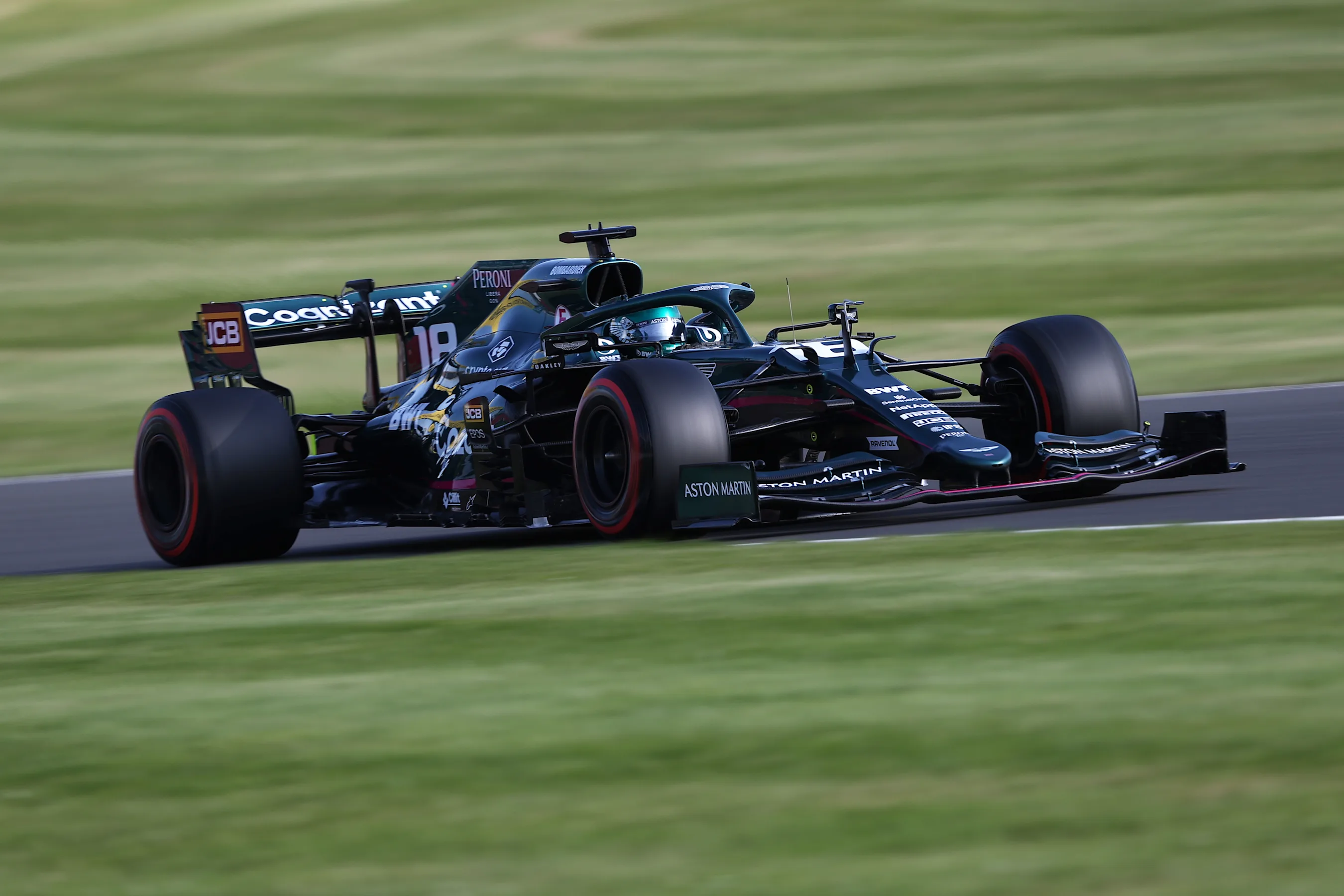 NORTHAMPTON, ENGLAND - JULY 16: Lance Stroll of Canada driving the (18) Aston Martin AMR21 Mercedes