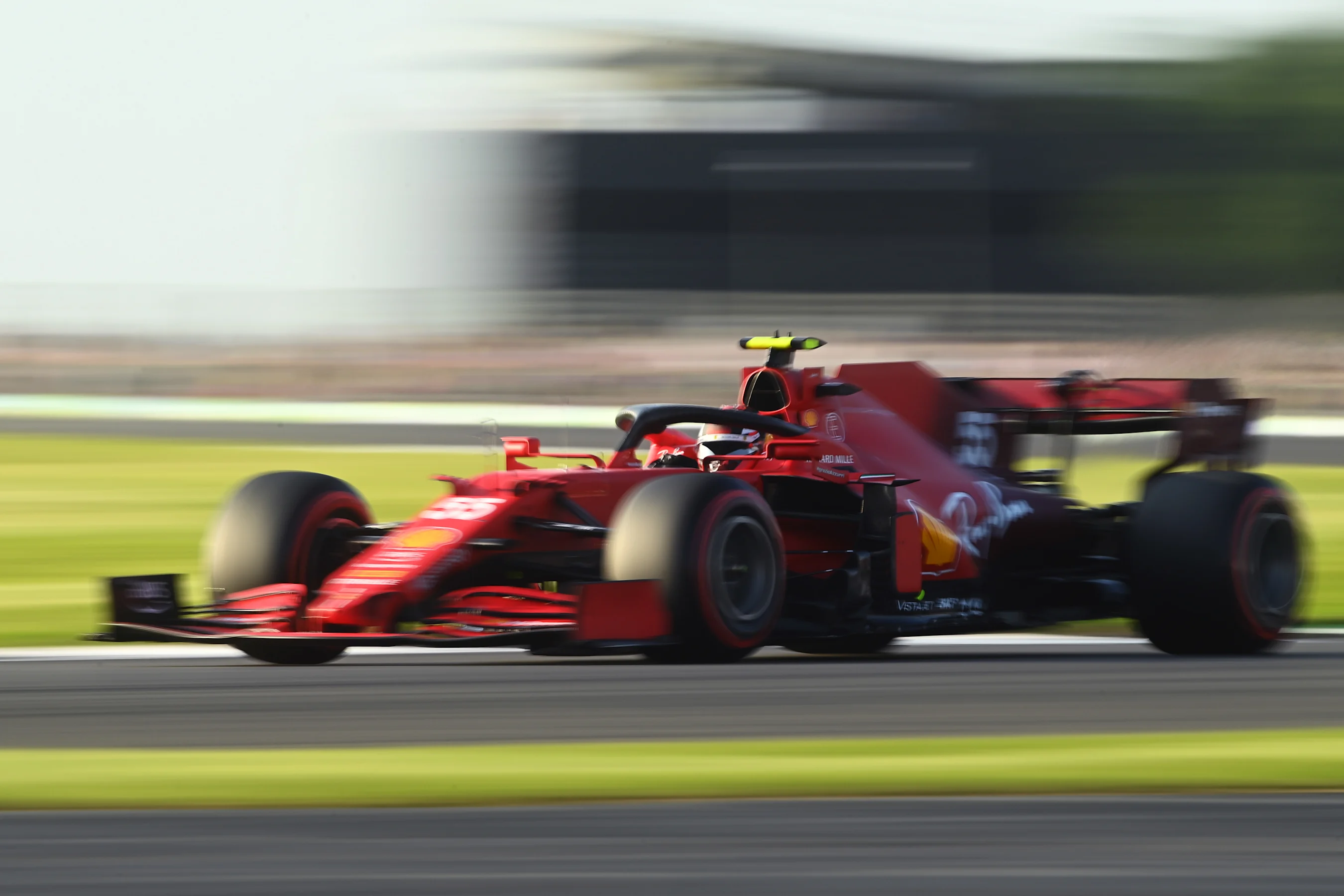 NORTHAMPTON, ENGLAND - JULY 16: Carlos Sainz of Spain driving the (55) Scuderia Ferrari SF21 during