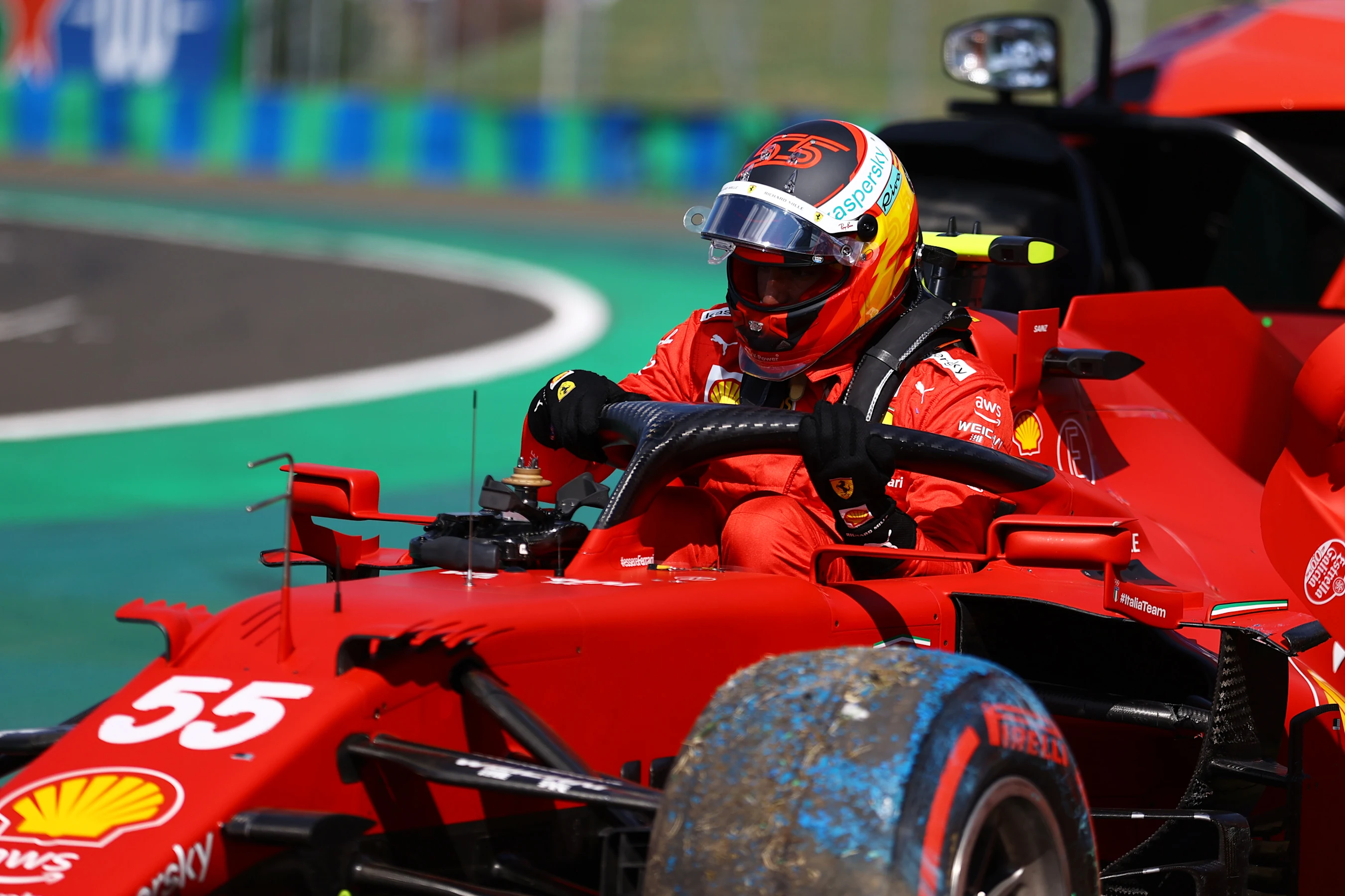 BUDAPEST, HUNGARY - JULY 31: Carlos Sainz of Spain driving the (55) Scuderia Ferrari SF21 climbs