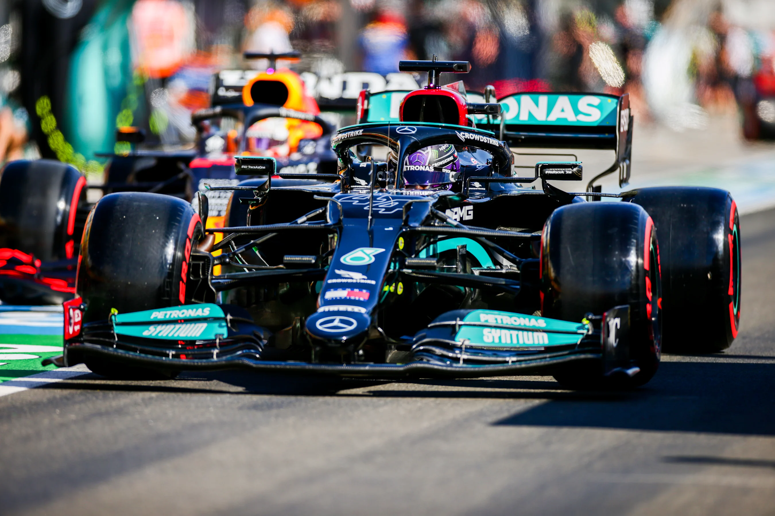 BUDAPEST, HUNGARY - JULY 31: Lewis Hamilton of Mercedes and Great Britain leads Max Verstappen of