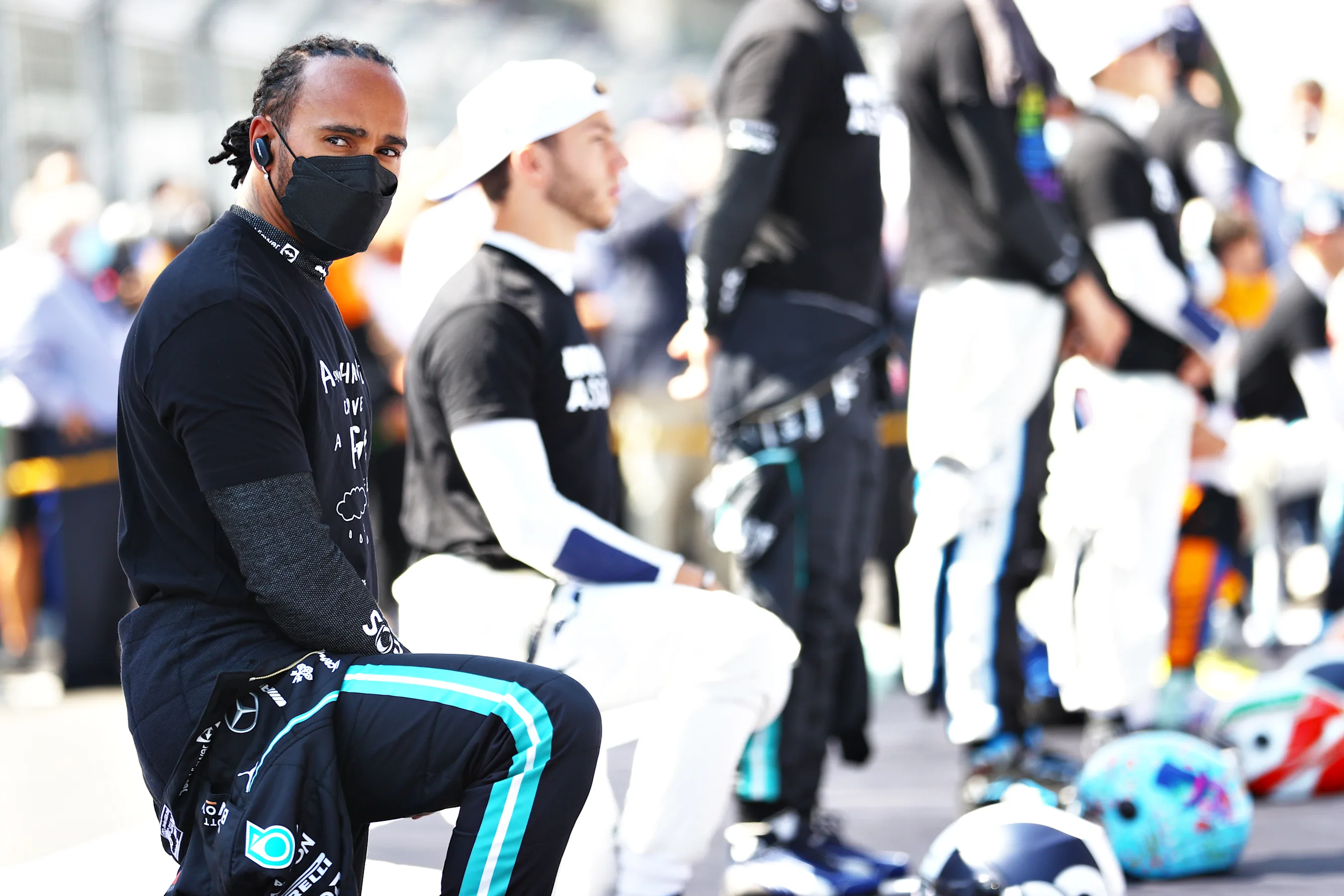MEXICO CITY, MEXICO - NOVEMBER 07: Lewis Hamilton of Great Britain and Mercedes GP takes a knee on