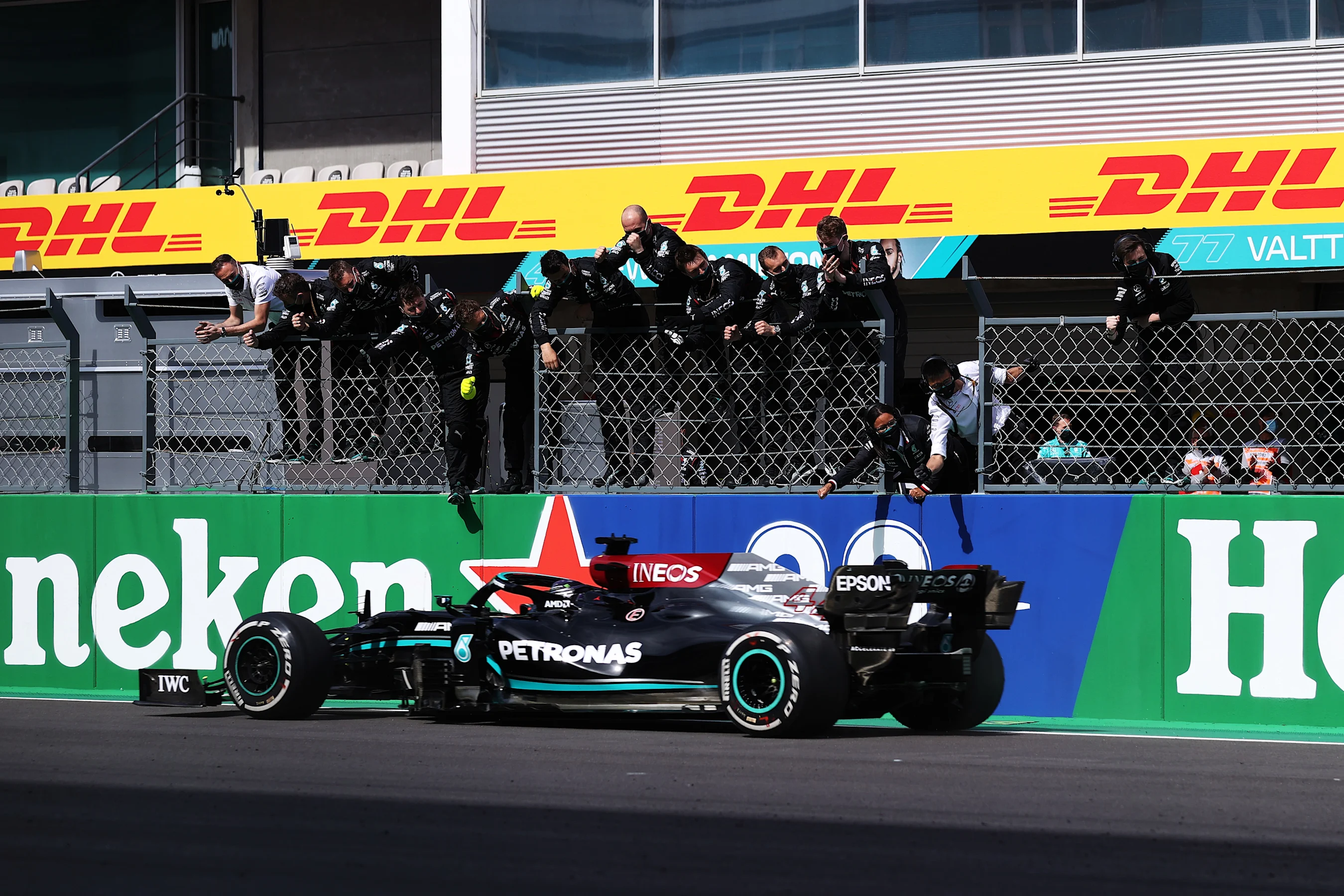 PORTIMAO, PORTUGAL - MAY 02: Mercedes GP team members celebrate on the pitwall as Lewis Hamilton of