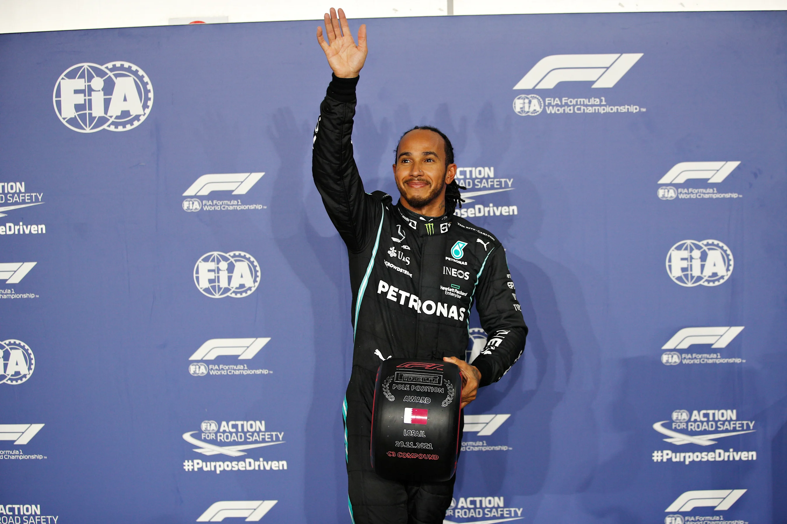 DOHA, QATAR - NOVEMBER 20: Pole position qualifier Lewis Hamilton of Great Britain and Mercedes GP