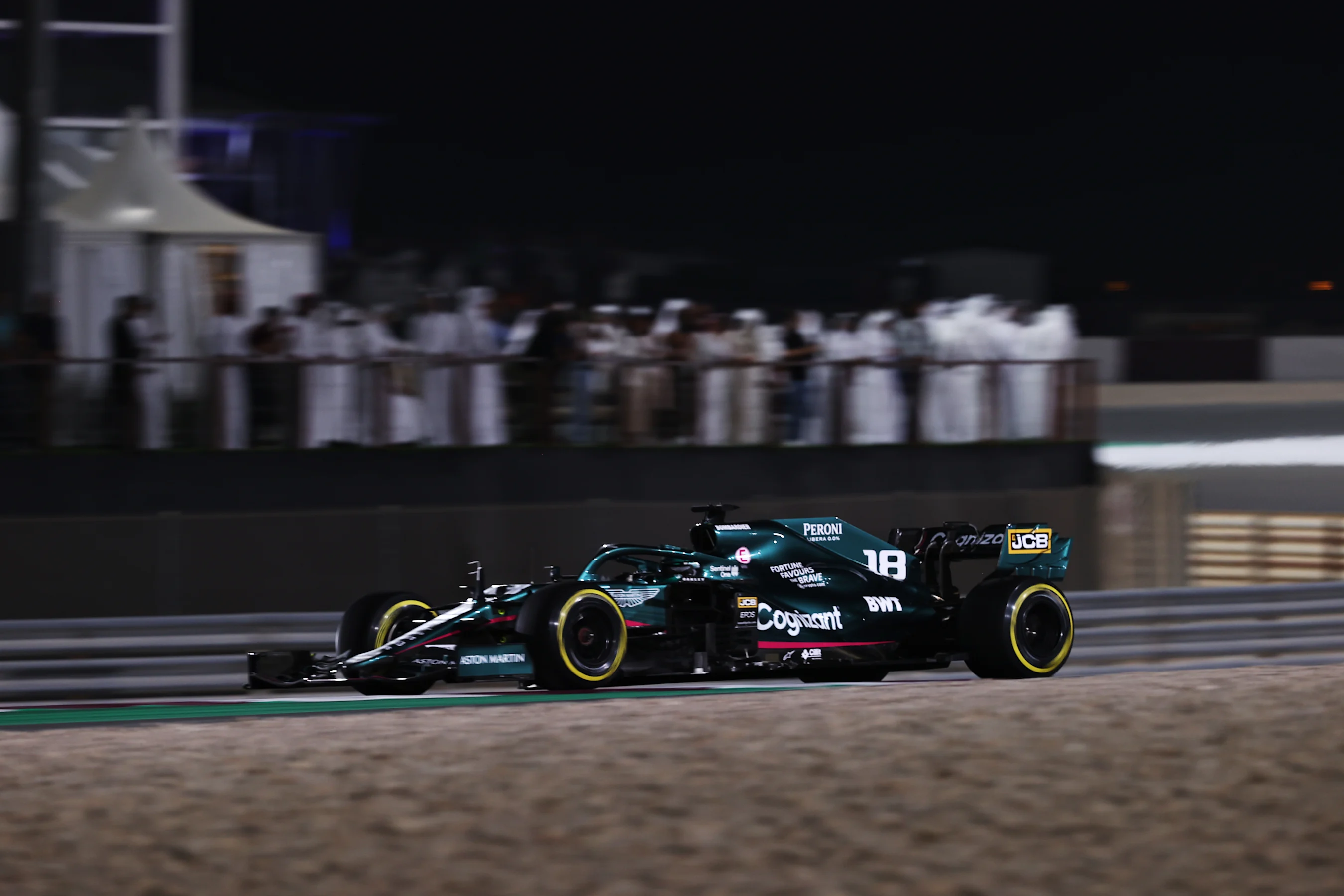 DOHA, QATAR - NOVEMBER 21: Lance Stroll of Canada driving the (18) Aston Martin AMR21 Mercedes