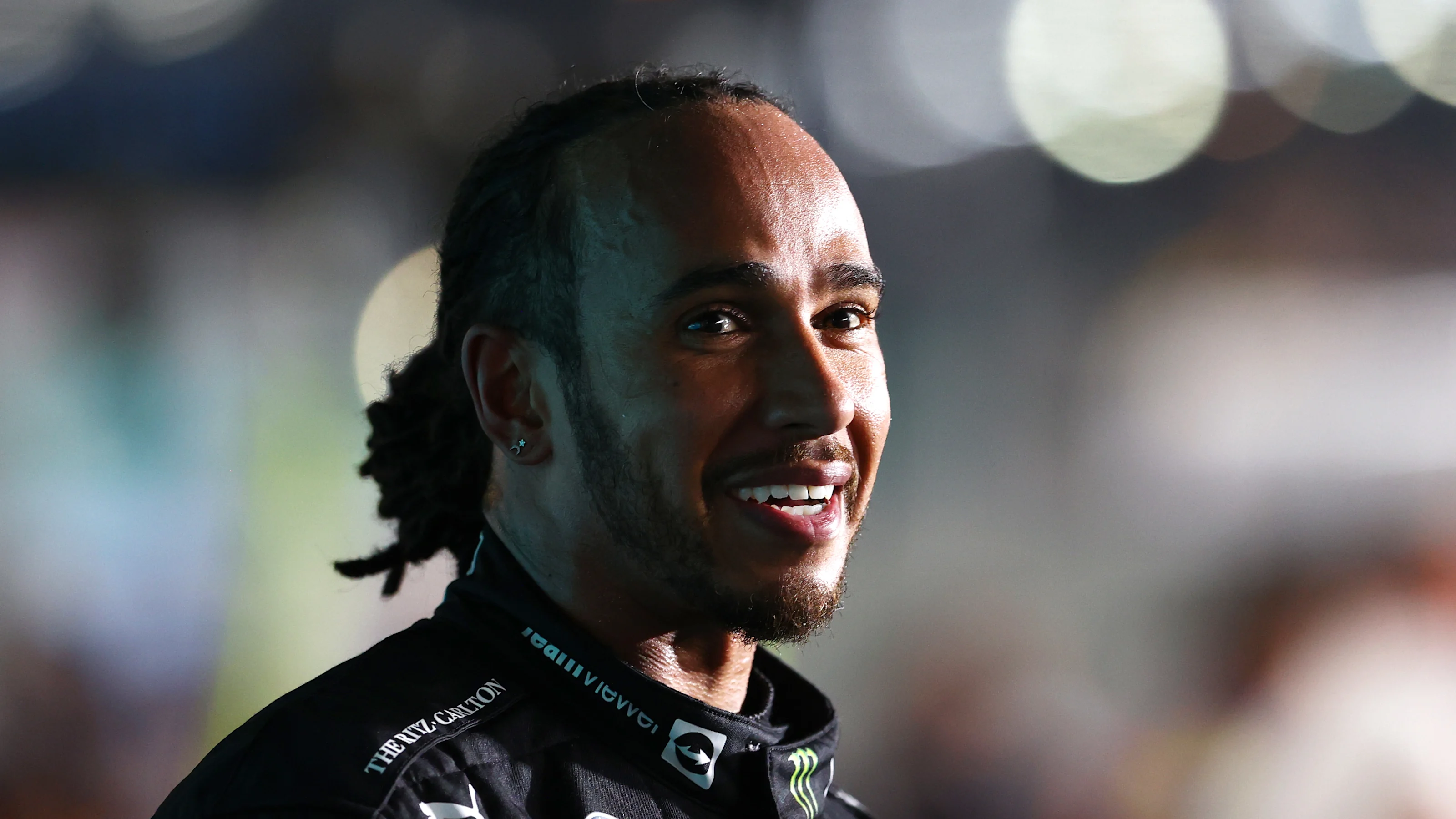 DOHA, QATAR - NOVEMBER 21: Race winner Lewis Hamilton of Great Britain and Mercedes GP looks on as