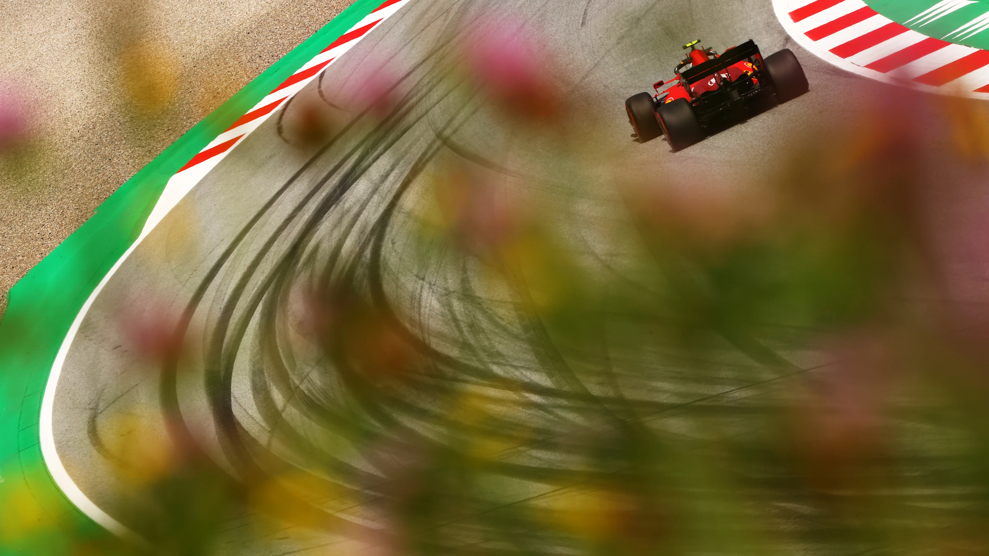 SPIELBERG, AUSTRIA - JUNE 25: Carlos Sainz of Spain driving the (55) Scuderia Ferrari SF21 on track