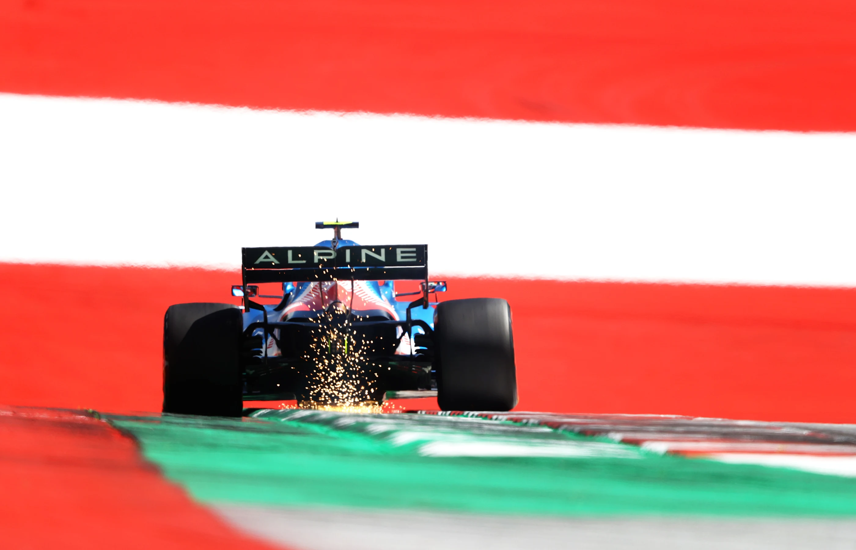 SPIELBERG, AUSTRIA - JUNE 26: Sparks fly behind Esteban Ocon of France driving the (31) Alpine A521
