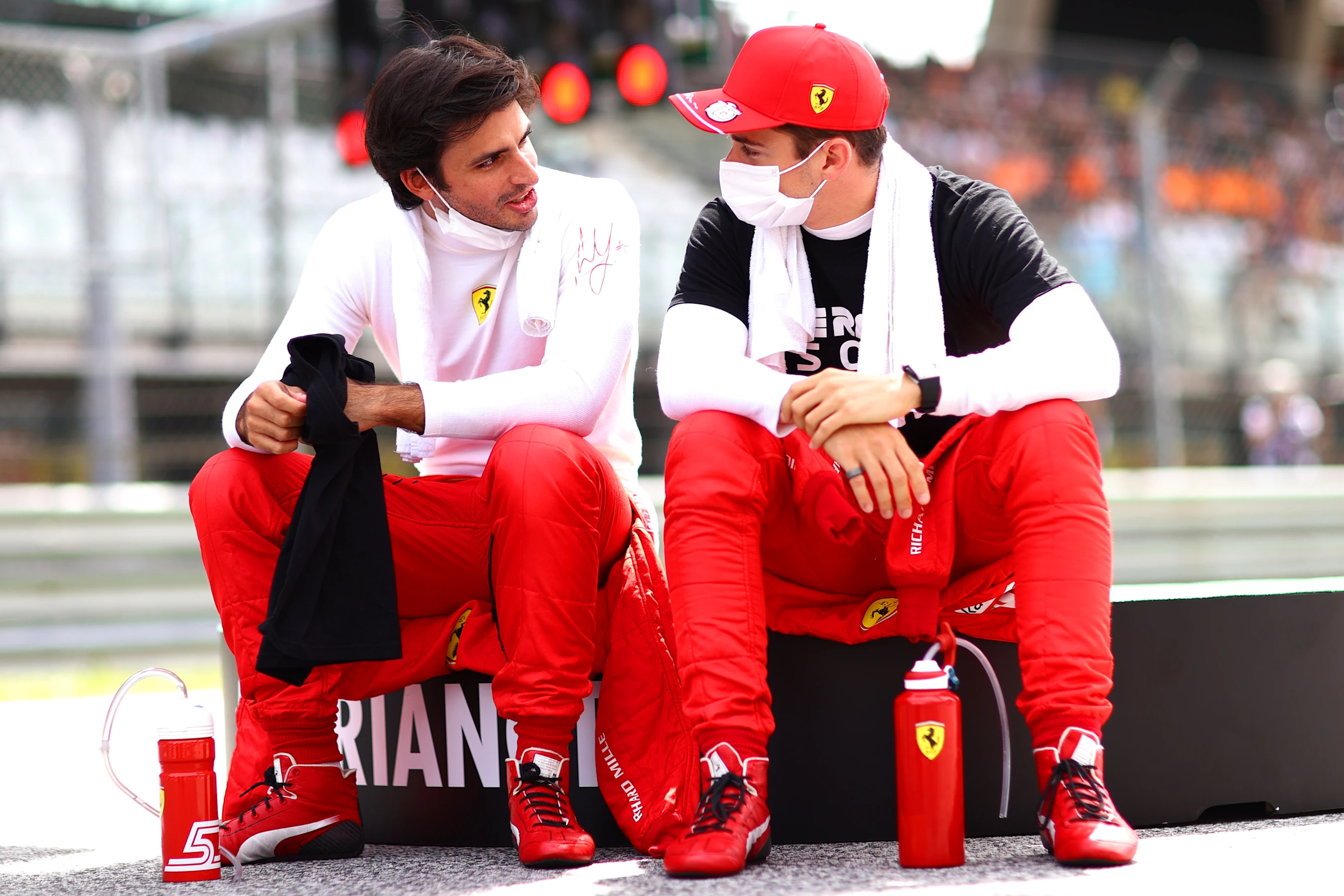 SPIELBERG, AUSTRIA - JUNE 27: Carlos Sainz of Spain and Ferrari and Charles Leclerc of Monaco and
