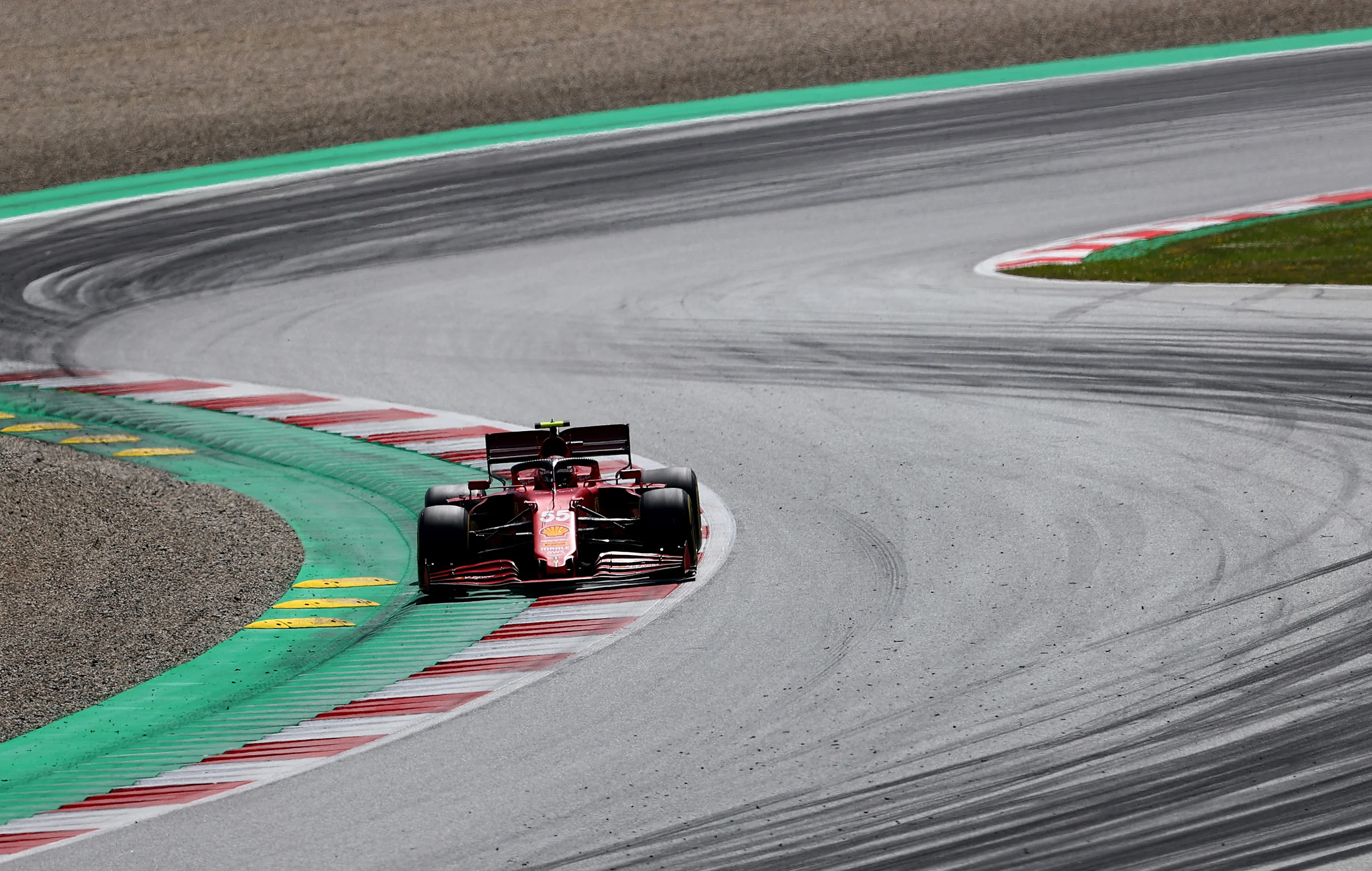 SPIELBERG, AUSTRIA - JUNE 27: Carlos Sainz of Spain driving the (55) Scuderia Ferrari SF21 during